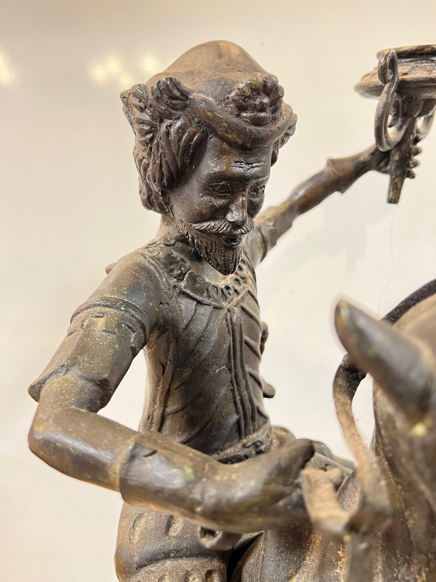 Cast Bronze Warrior or Rider Mounted on a Rearing Horse Holding a Torch Statue For Sale