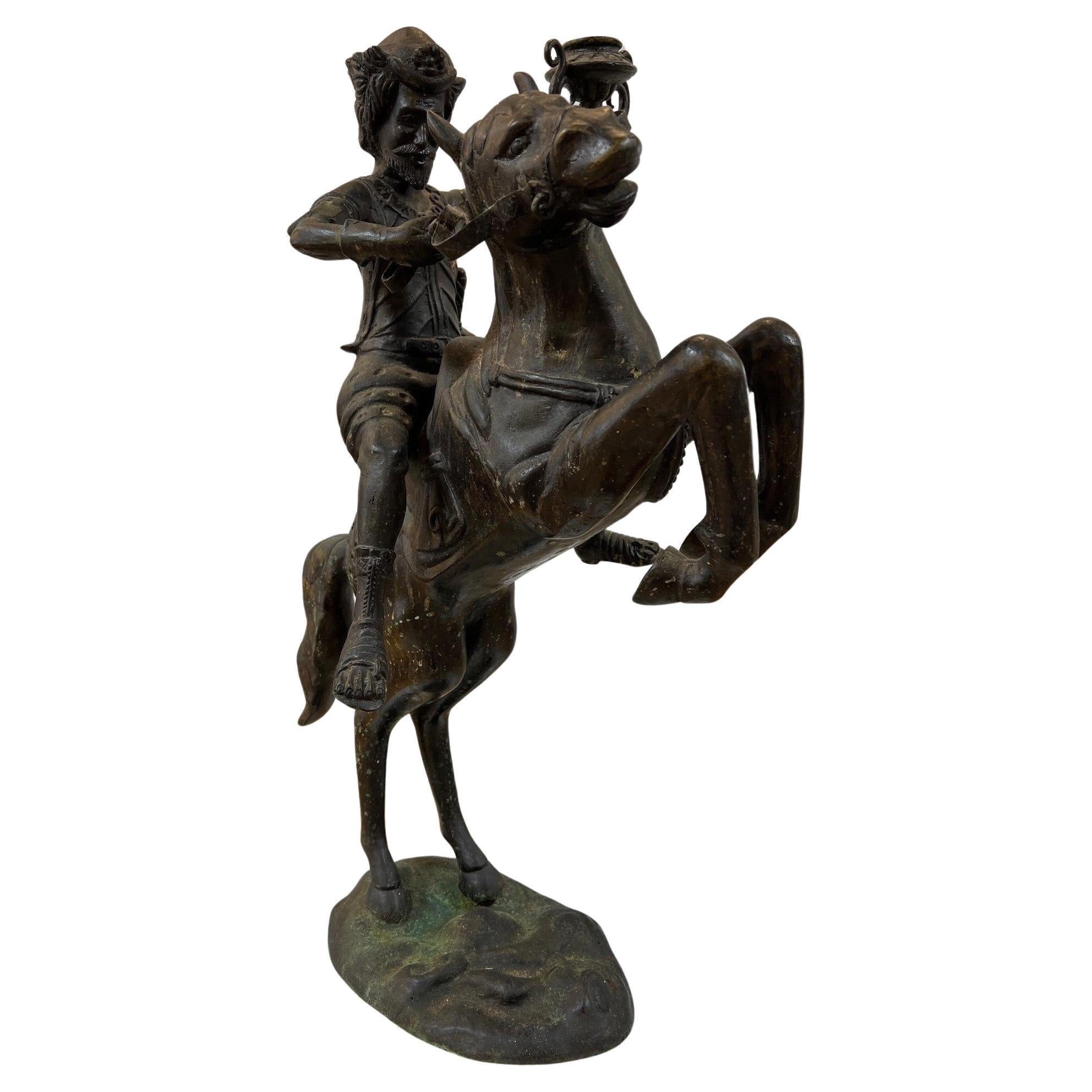 Bronze Warrior or Rider Mounted on a Rearing Horse Holding a Torch Statue