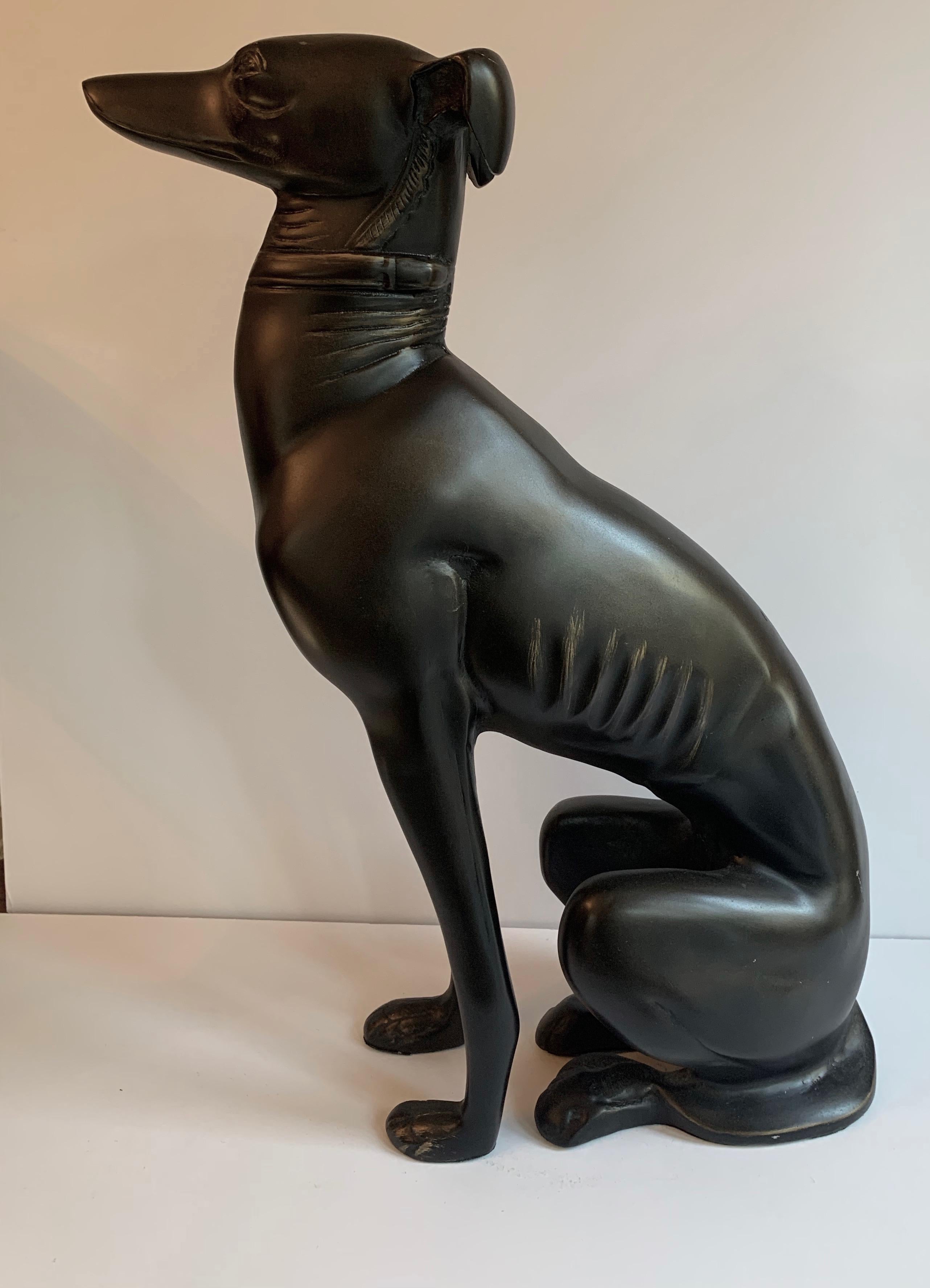 Handsome and wonderfully decorative, made of bronze and in very good condition this whippet seated in any room, or corner gives a great deal of character.