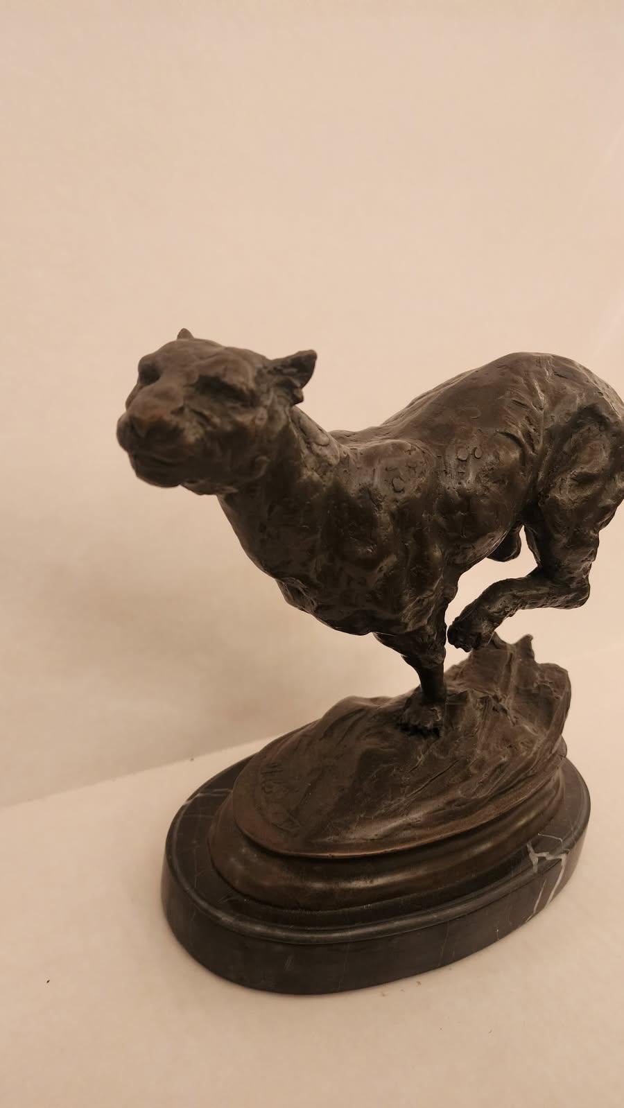 This listing features a lost wax cast bronze running Panther that was sculpted by the artist Miguel Fernando Lopez. This wonderful sculpture is bronze with a marble base. The attention to detail is evident in every carefully sculpted muscle,
