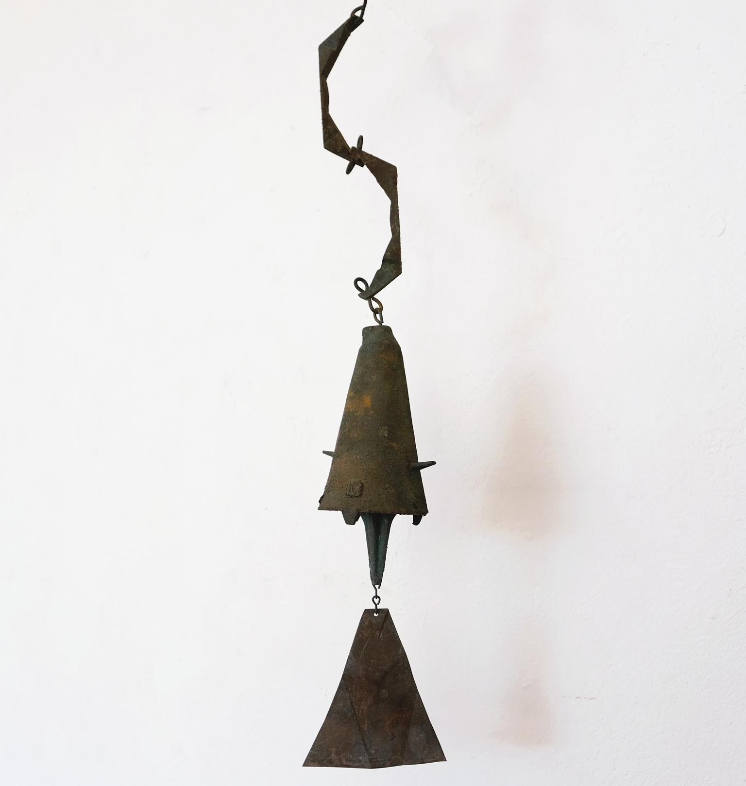 Early bronze sculptural wind chime or bell by Italian-born visionary architect and artist, Paolo Soleri. This piece was made by the artist at his Cosanti studio in Arizona. The protrusions on the sides are elements only seen in the early bells,
