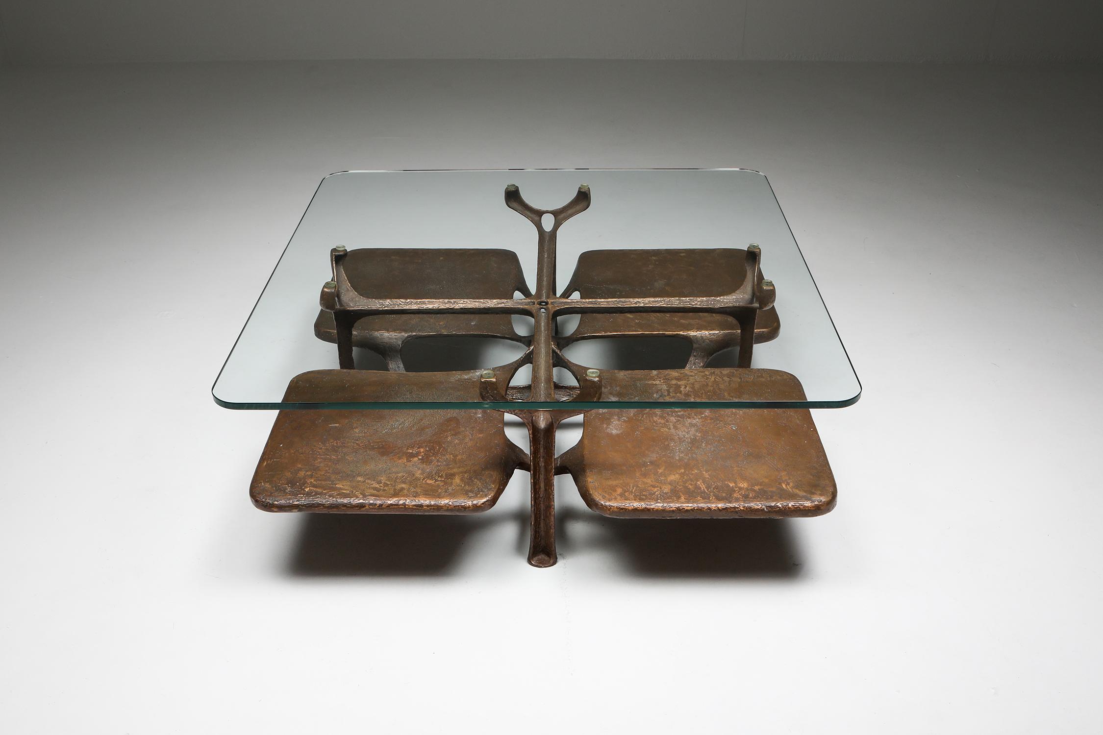 Bronze sculptural coffee table, monogrammed AH

Artist two-tier coffee table in bronze with glass top
Brutalism meets Hollywood Regency
Superb piece in cast bronze comprised of four leafs with a clear round edged glass top.
Sculpturally strong
