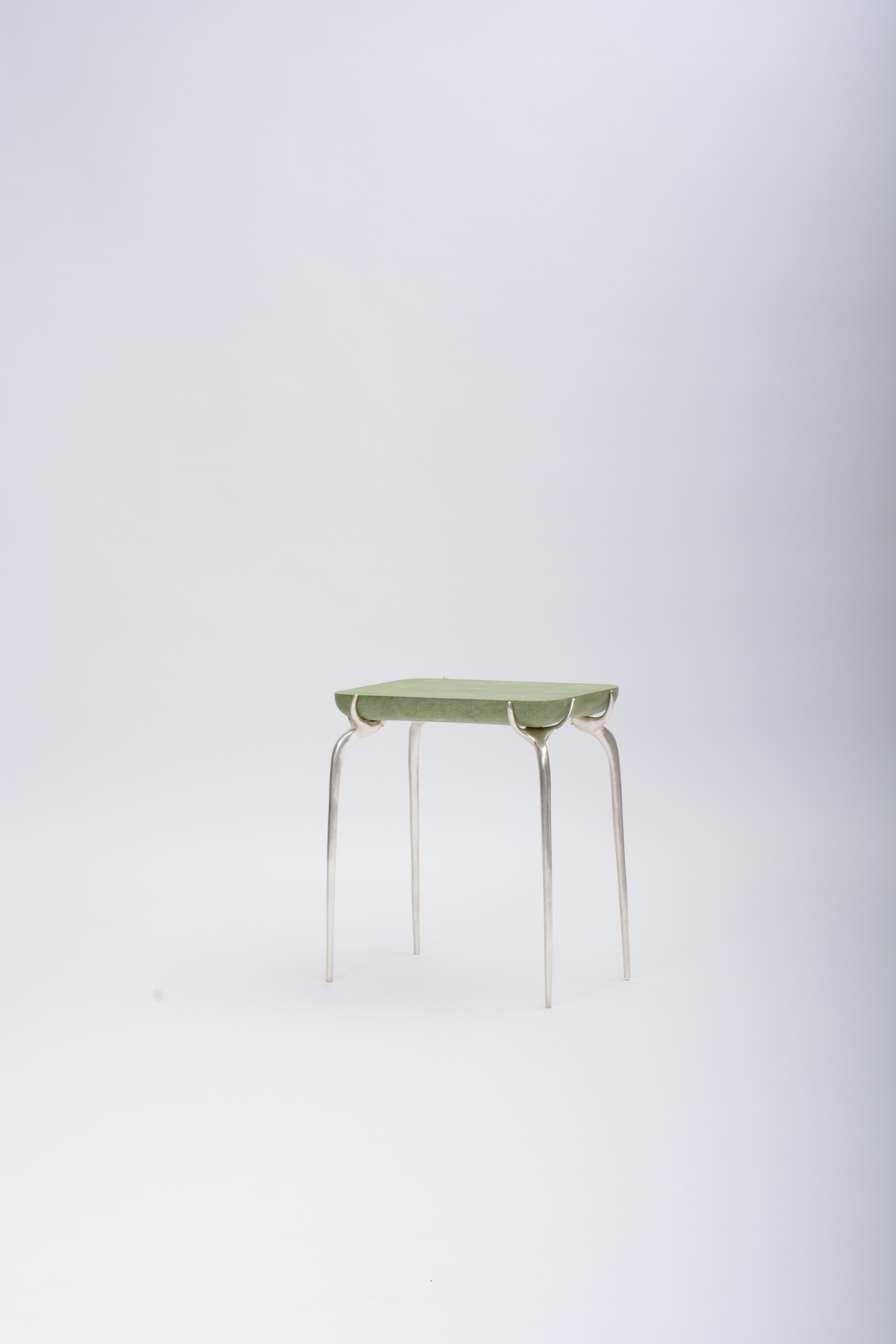 Jewel Side Table with Bronze, Silver Leaf, and Green Shagreen by Elan Atelier

The Jewel Side Table is inspired by a contemporary sculpture in mediums of wood, metal and stone. Our creative director references sculptors such as Louis Bourgeois as an