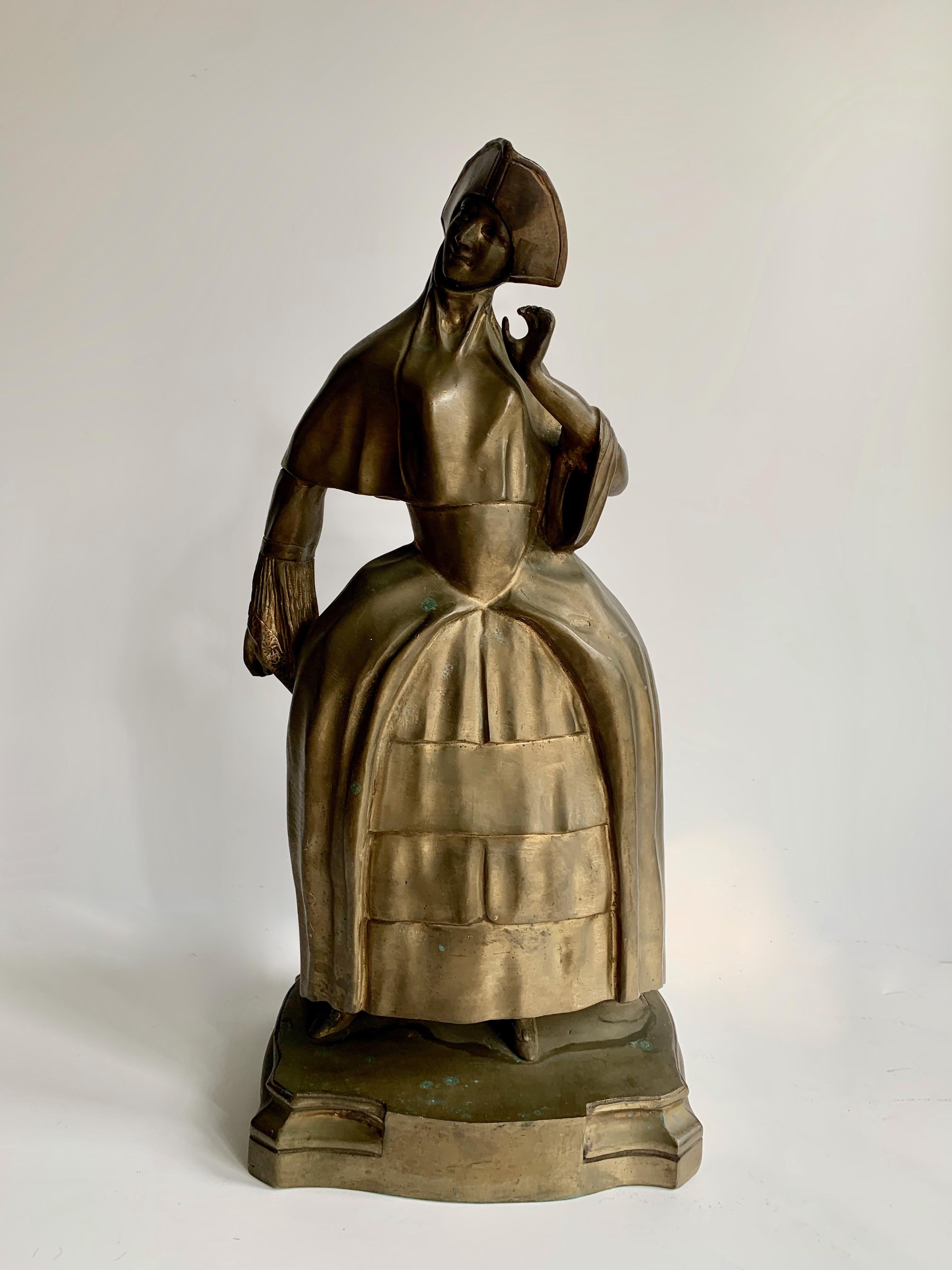 A wonderful sculptural figure of a lady, intricate in detail and wearing women's medieval attire and hat. 

A good weight at 18 lbs - use as a heavy duty bookend, decor or door stop. Be creative! 

 