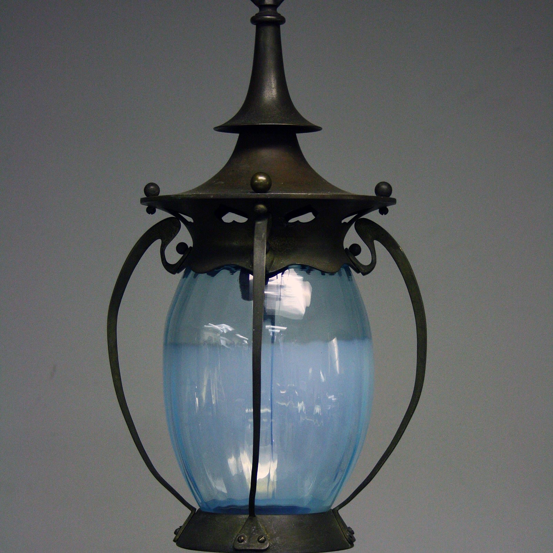A stunning Art Nouveau lantern with bronzed brass frame work and with original blue glass, in excellent condition and has been rewired and PAC tested.