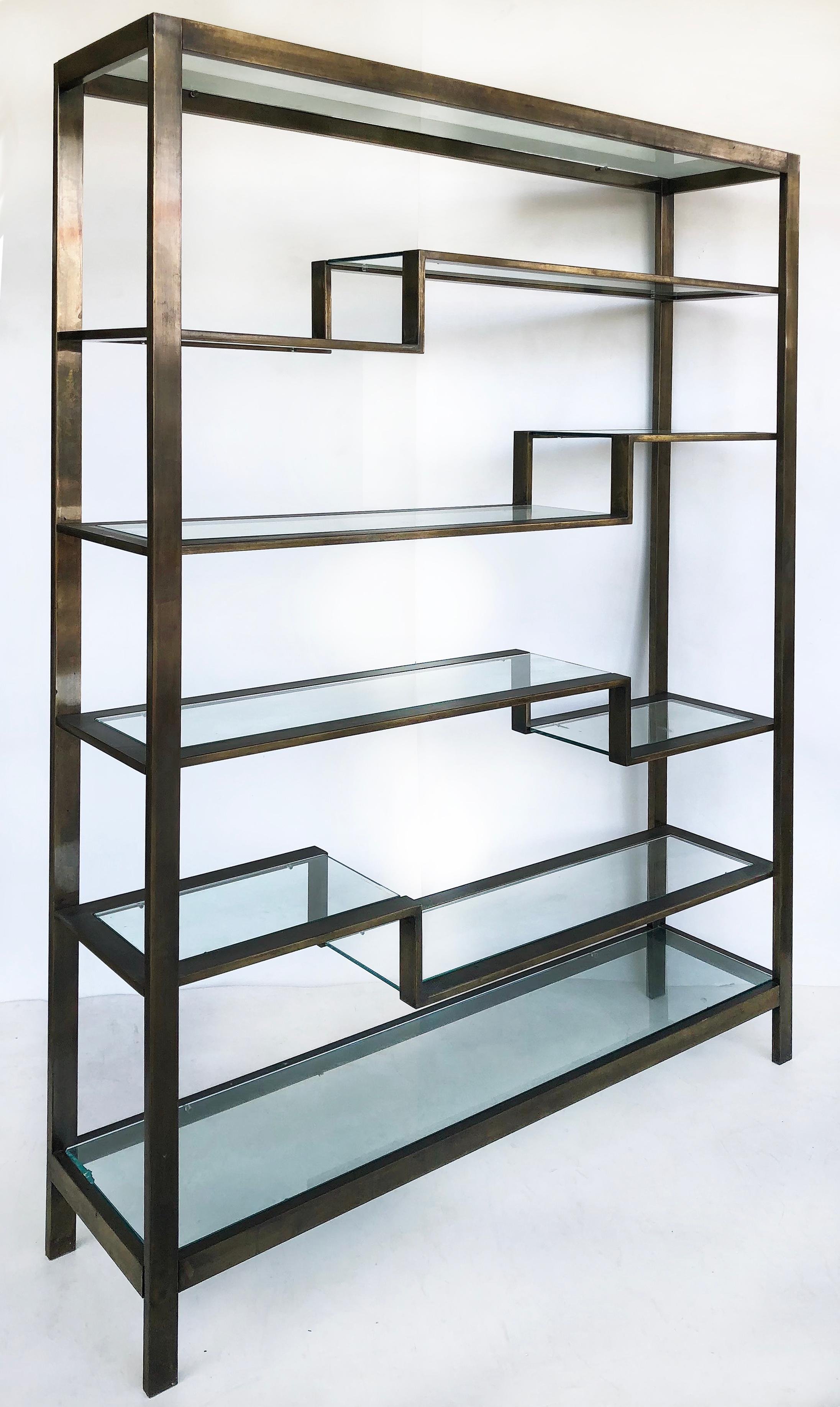 Bronzed Finish Mid-Century Modern etagere metal shelving with glass shelves

Offered for sale is a Mid-Century Modern etagere created in a bronze finish with 4 central staggered angled shelves with glass. The top and base levels have glass shelves