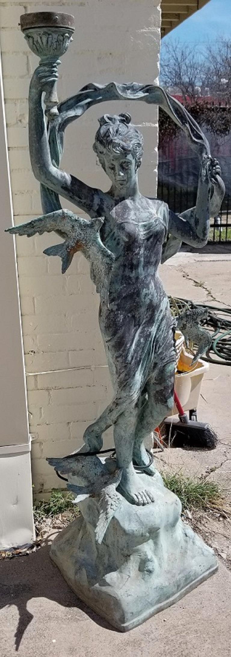 Bronzed Garden Statue of a Lady with Torch and Birds In Good Condition In Dallas, TX