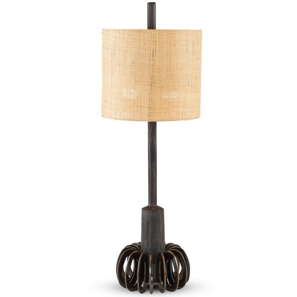 The Silhouette lamp collection is inspired by Brutalist forms. The dark ebonized oak is combined with bronzed steel components and finished with a raffia shade.
The Silhouette lamps are tall at 107cm which give them a strong sculptural presence in