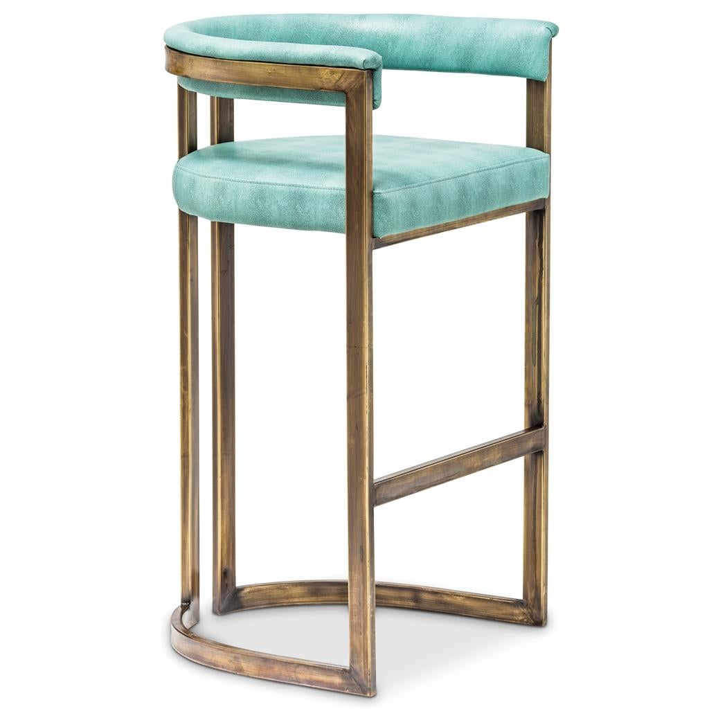 This classically inspired contemporary bar stool by Egg Designs, has a burnished bronze steel frame and is upholstered in shagreen textured vinyl. This bar stool is recommended for residential, hospitality and restaurant applications. It is