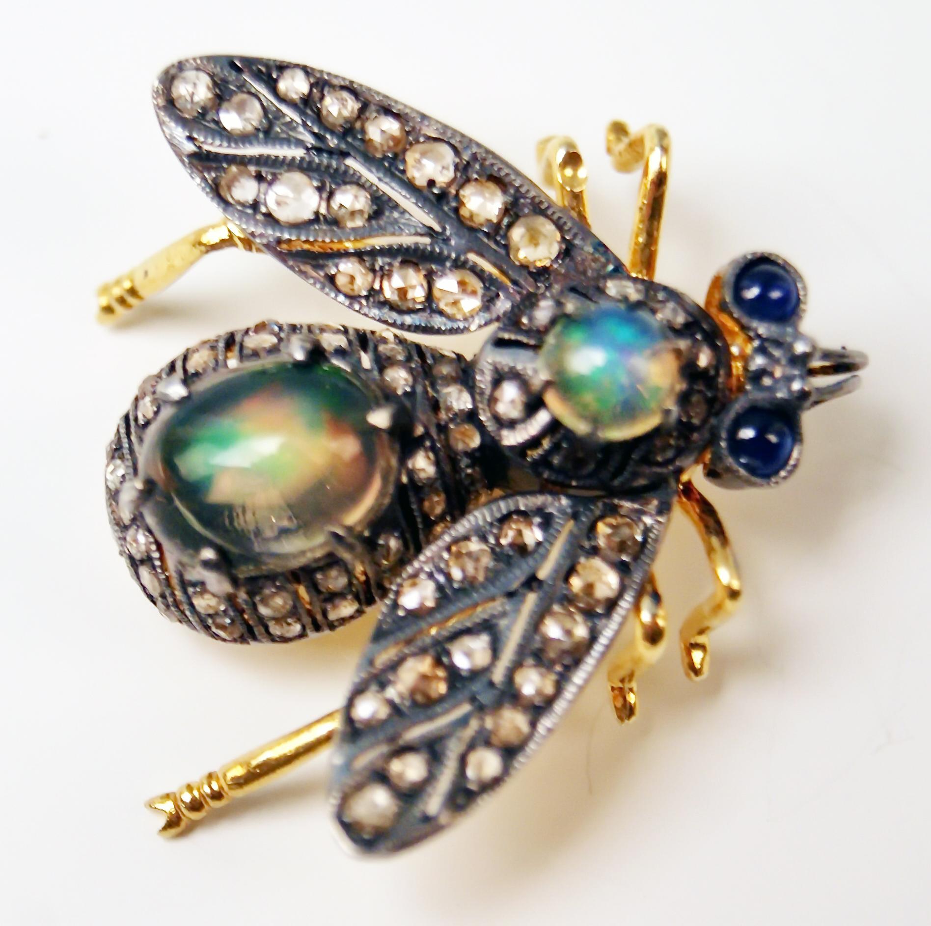 Rare jewellery piece made around Turn of Century (1900):
The brooch is shaped as bee, being abundantly covered with diamonds. Additionally, this nicest yellow golden jewellery piece is covered with two opals as well as with two blue sapphires which