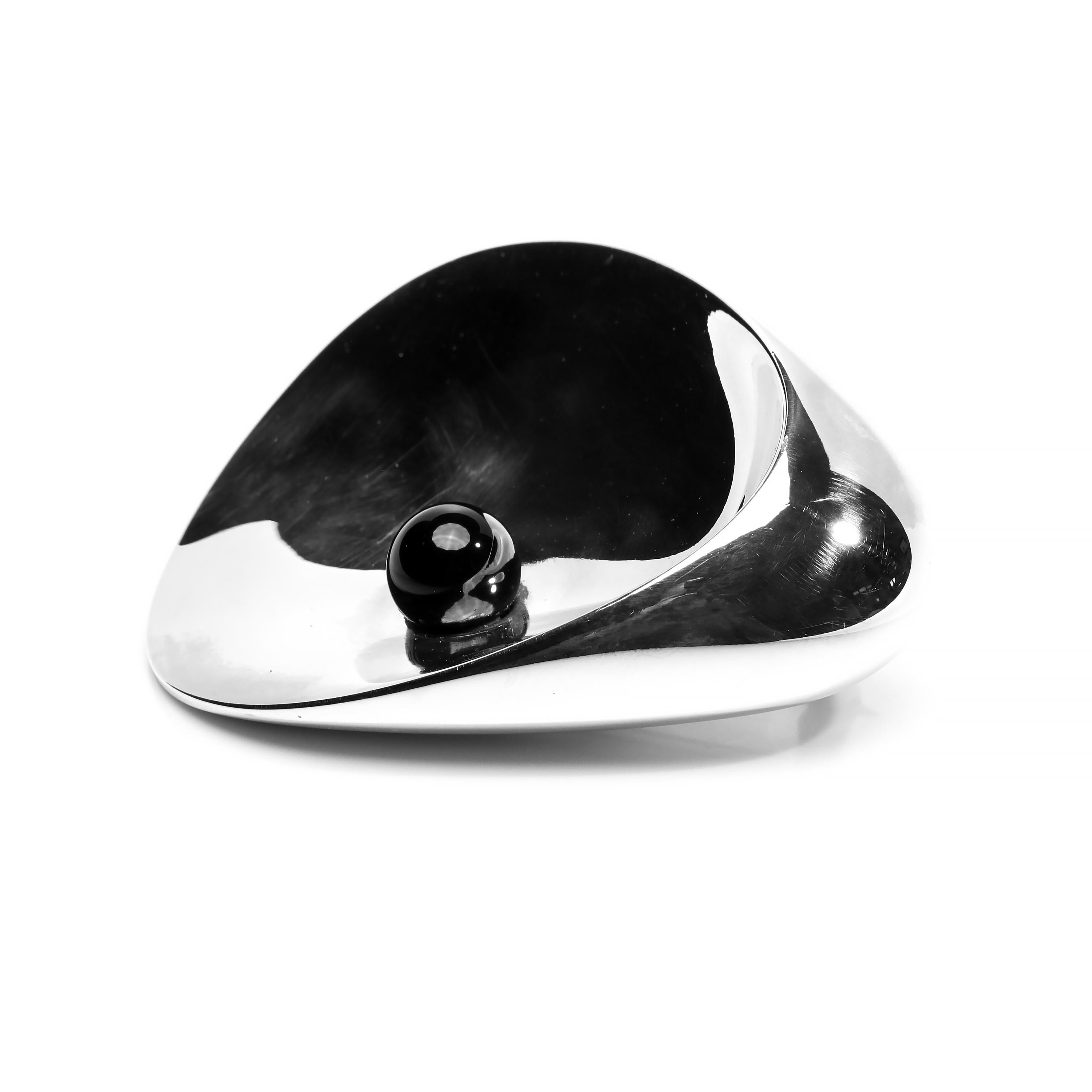 This magnificent and brilliantly simple silver and onyx brooch was created in the 1950s for the firm for Georg Jensen by Nanna and Jørgen Ditzel. The wife and husband design team created spectacular pieces of furniture including the iconic “Hanging
