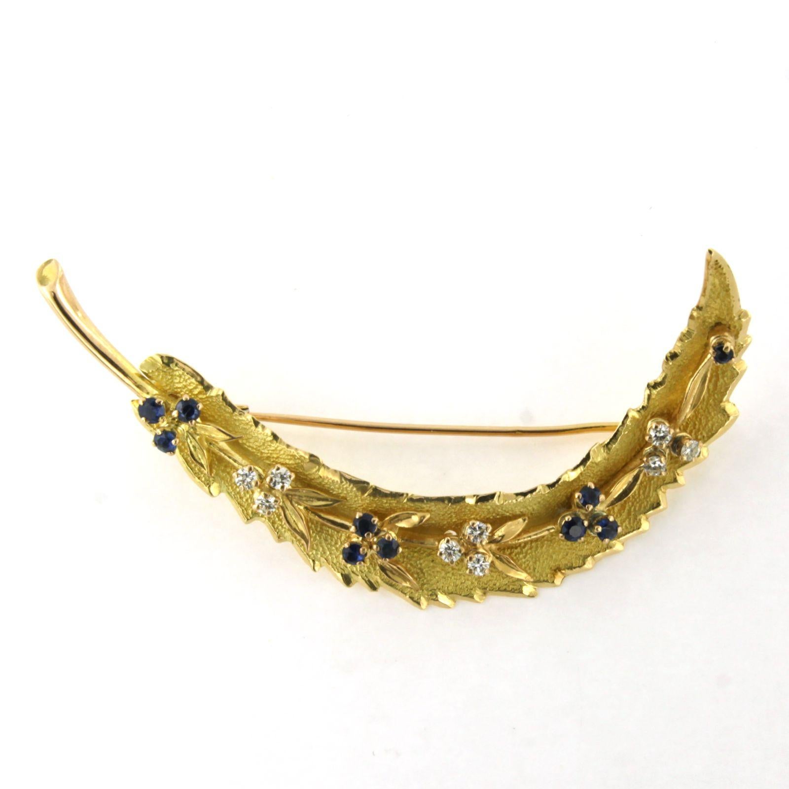 Modern Brooch in a shape of a feather with sapphire and brilliant cut diamonds 18k gold For Sale