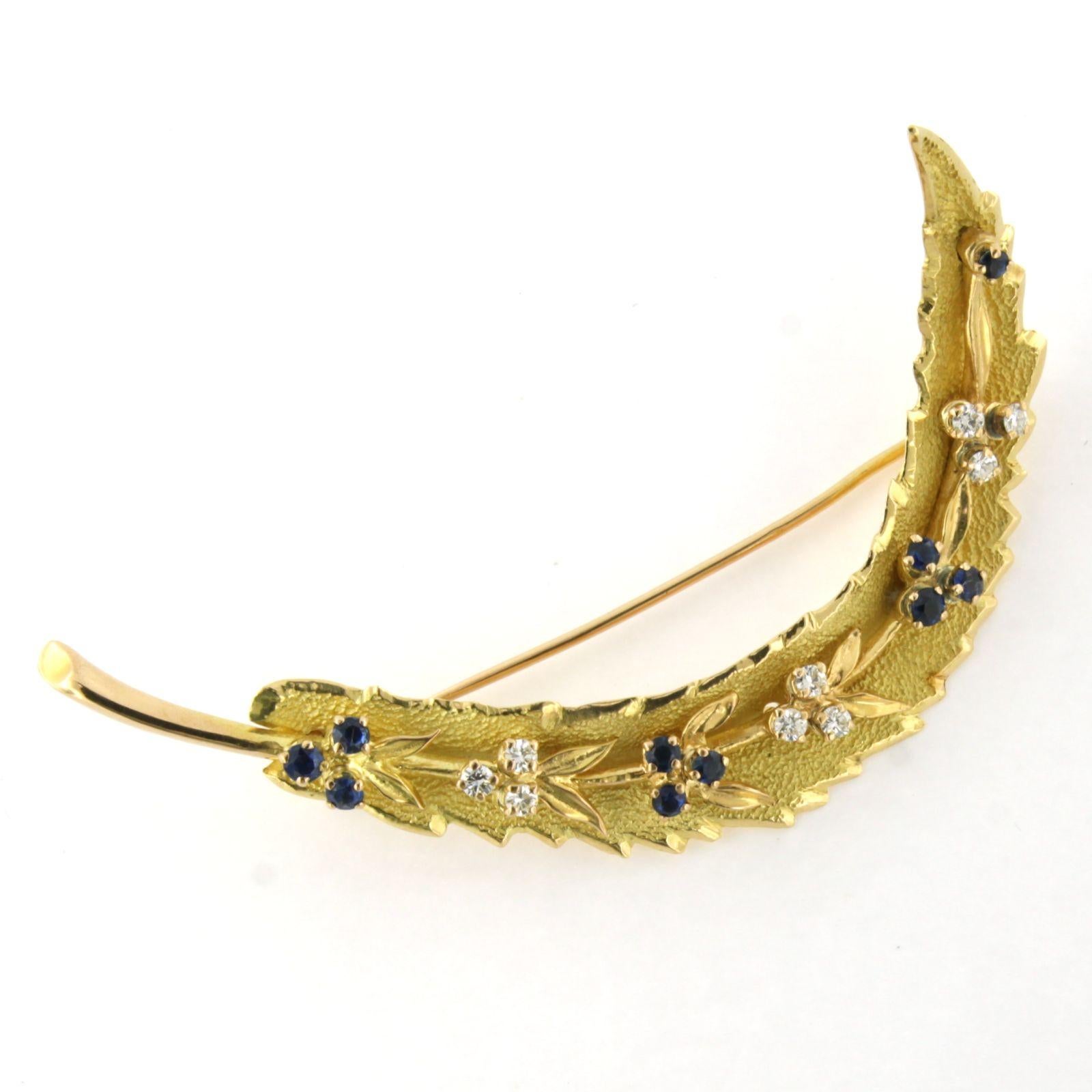 Brilliant Cut Brooch in a shape of a feather with sapphire and brilliant cut diamonds 18k gold For Sale