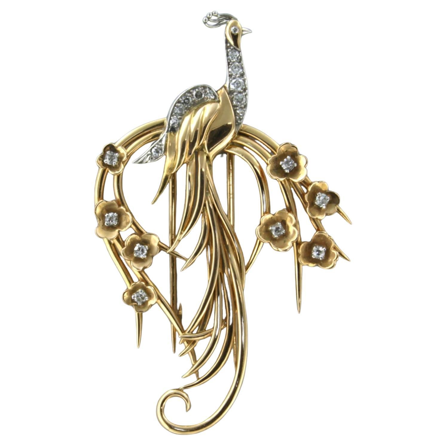 Brooch in a shape of a peacock with diamonds up to 0.60ct 18k bicolor gold