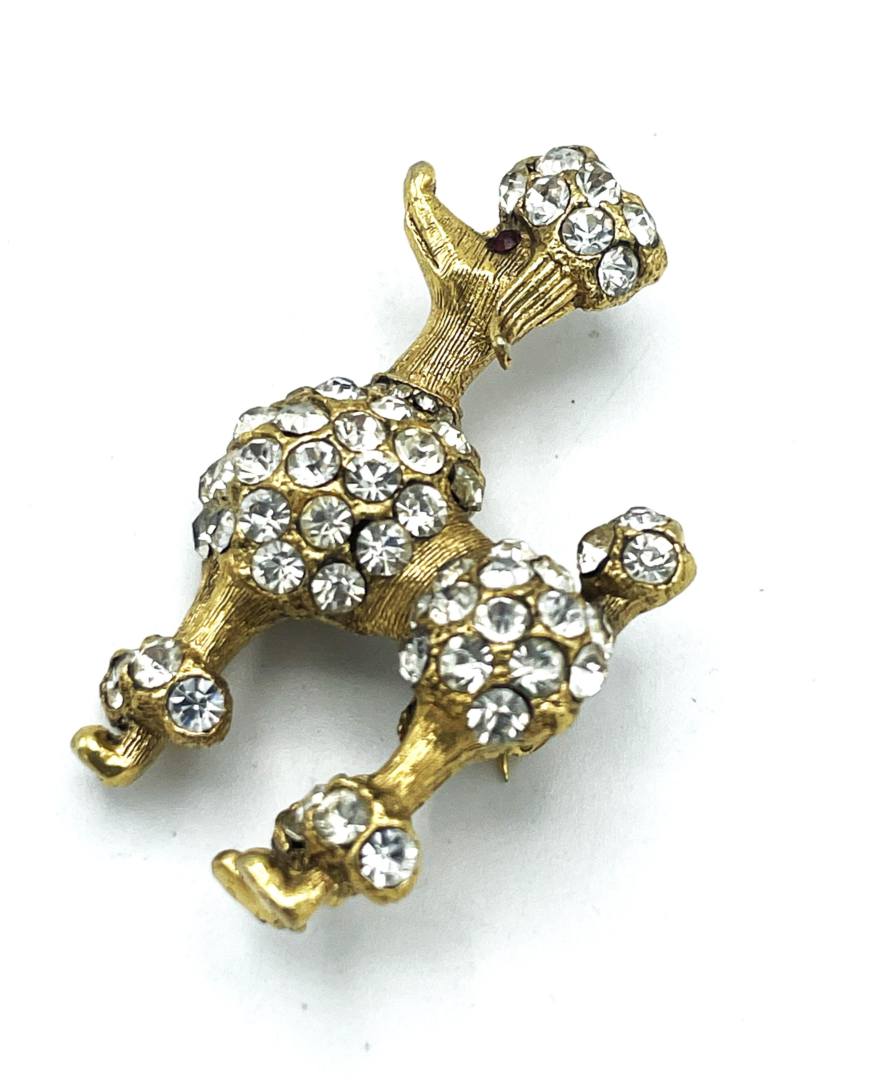 Women's or Men's Brooch in the shape of a proud poodle, set with rhinestones, signed BSK copyrigh For Sale