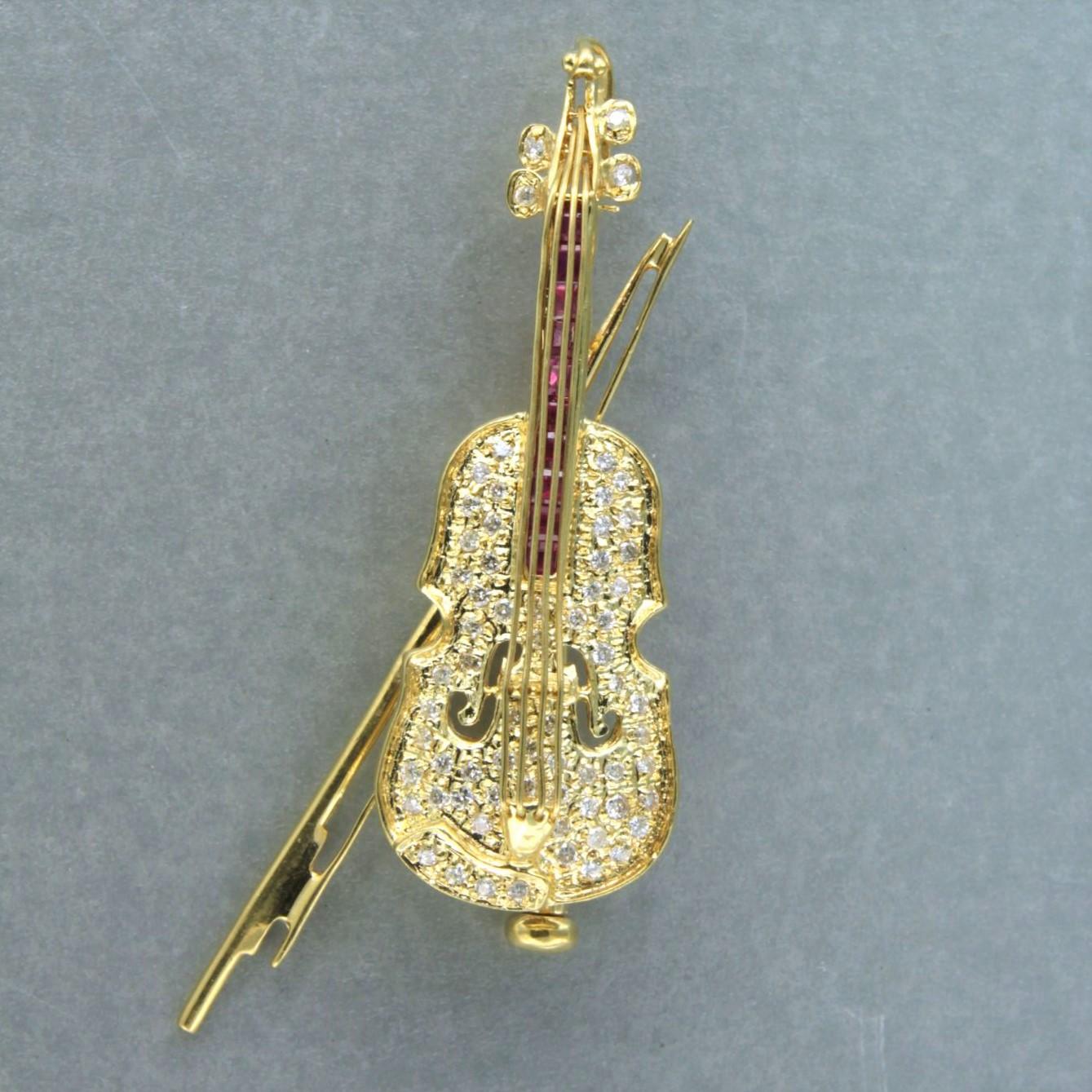 Brilliant Cut brooch in the shape of a violin set with ruby brilliant diamonds 18k gold