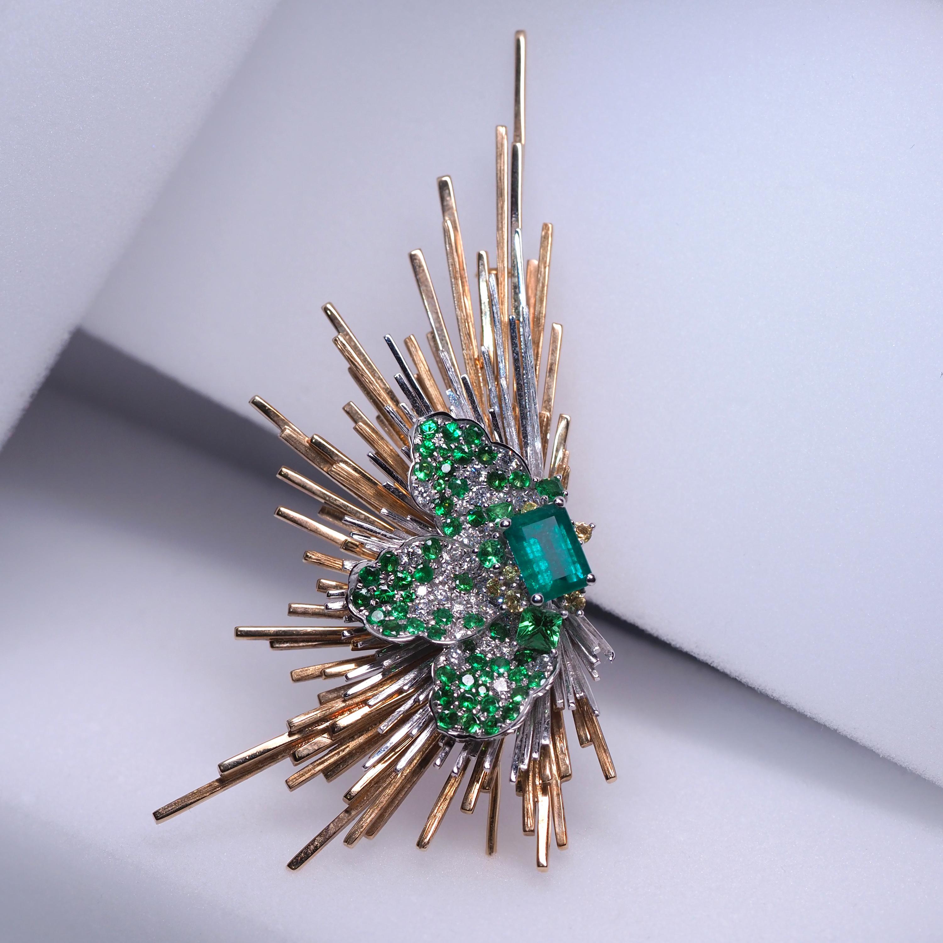 Shaped like a gorgeous feather with a flat-cut emerald as focus-point, this Emerald, Diamond Gold Brooch with Yellow Sapphire is so exquisite that it can be compared with one of the sculptural masterpieces of the Roman baroque style, the ‘Ecstasy of