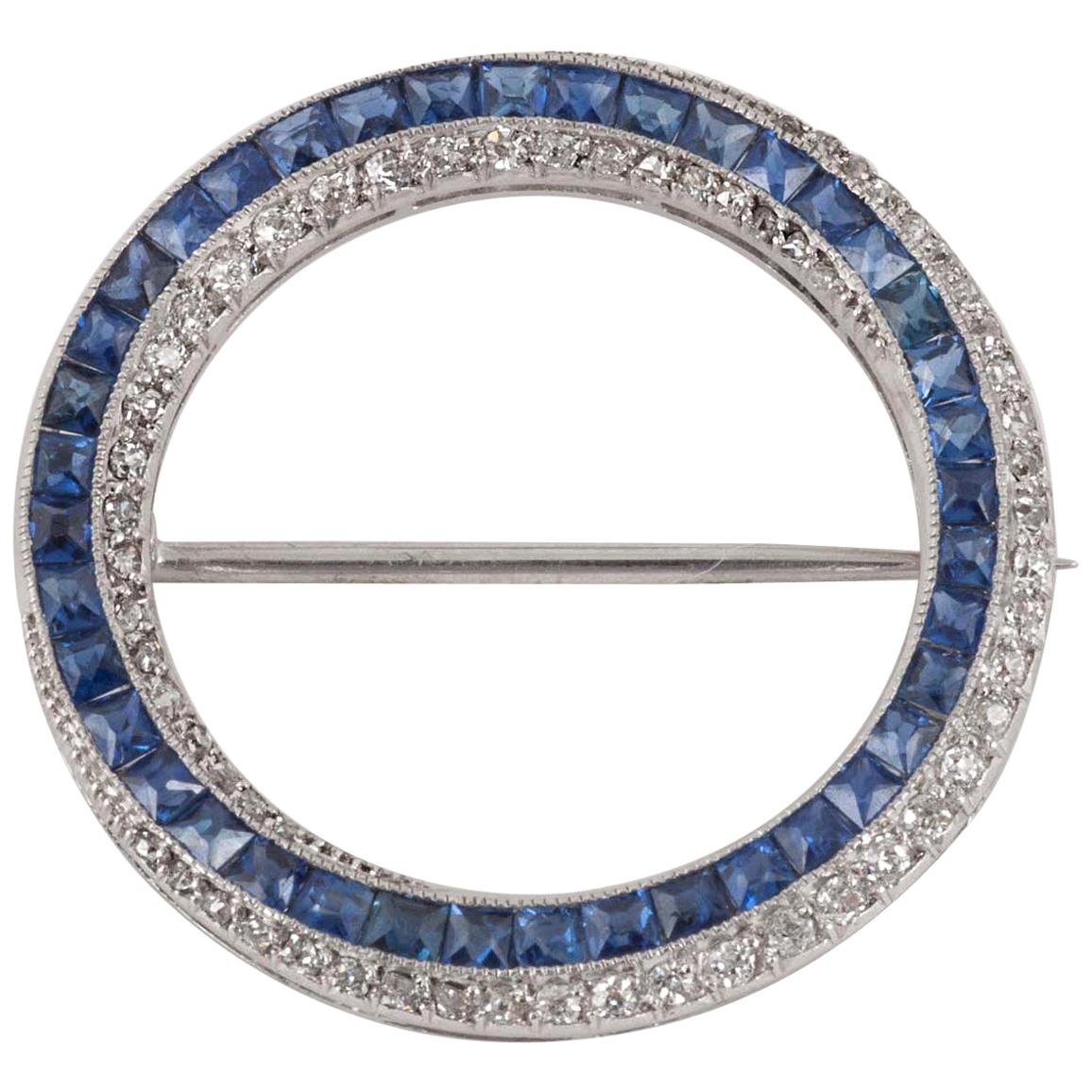 Open Circle Brooch in Platinum, Diamonds & Ceylon Sapphires, English circa 1960 For Sale