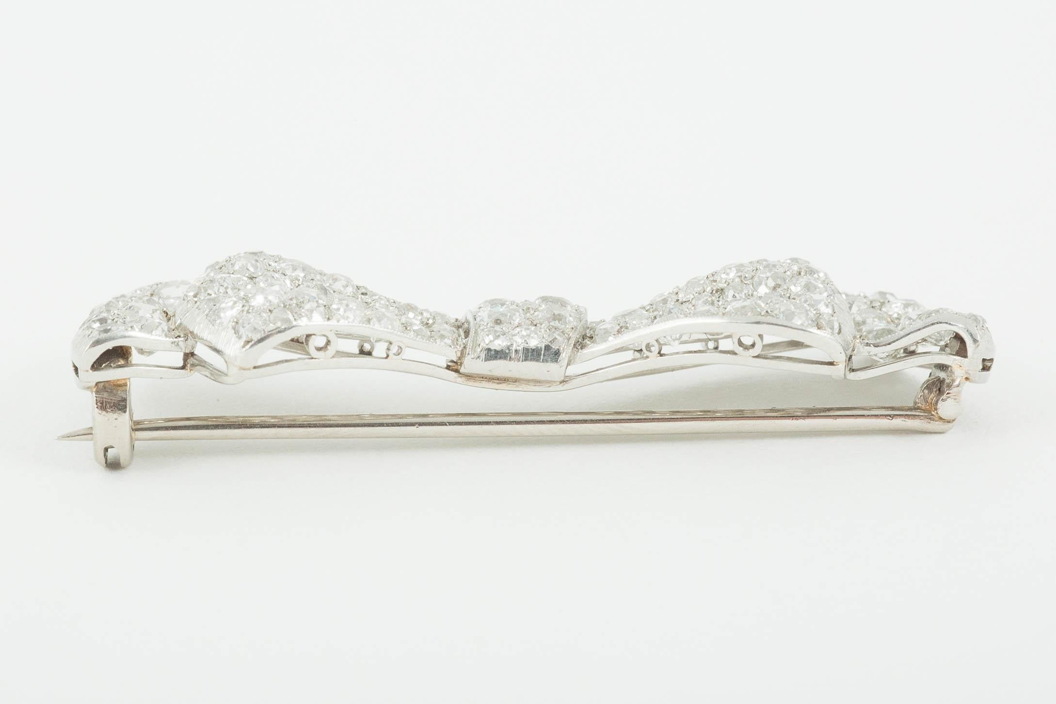 Round Cut  Bow Brooch, Platinum Mounted and Pave Set with Diamonds,  English circa 1920. For Sale