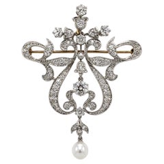 BROCHE - Schumann's Sons : fleur victorienne ancienne ornée d'un diamant de 4,25 carats et de perles.