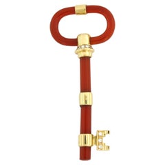 Brooch shape of a key with carnelian and diamond up to 0.20ct 11.5 gram 18k gold