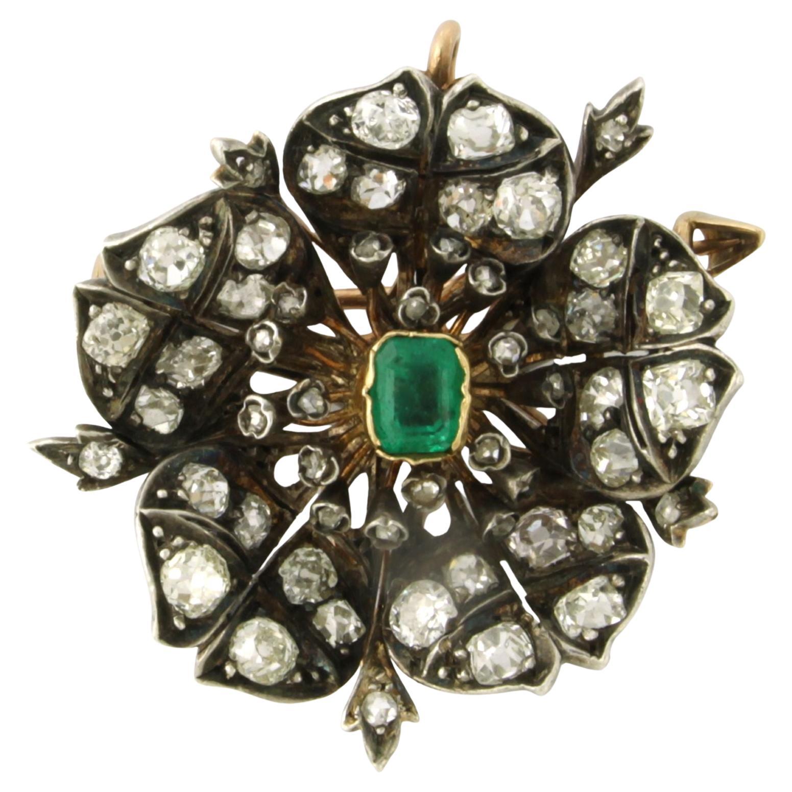 Brooch with emerald, old and rose cut diamonds up to 5.00ct 18k gold and silver