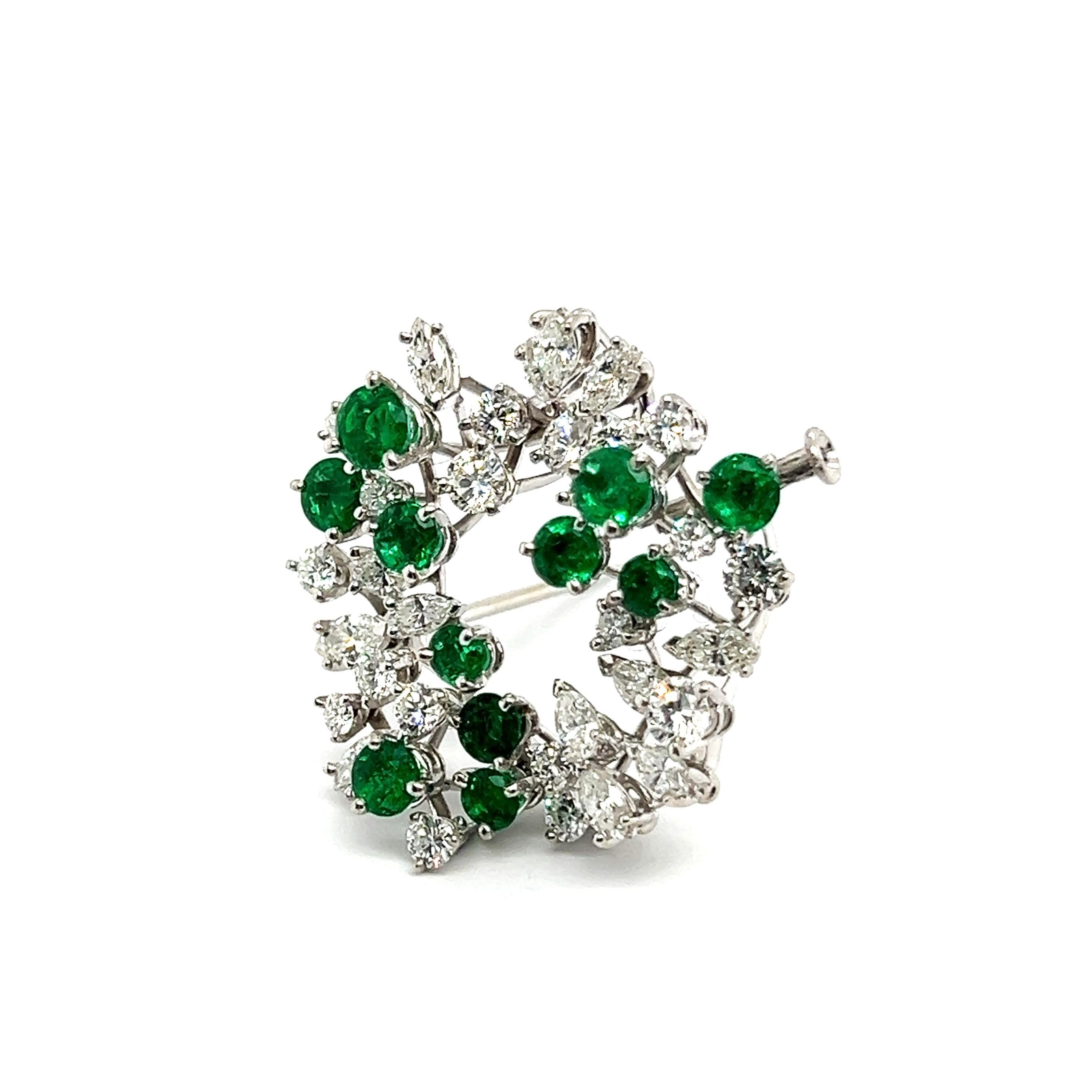 Introducing Meister Jewelers' creation: a brooch infused with the vibrant energy of a young spring, where nature awakens from its deep slumber. 

Created from 18 Karat white gold, adorned with 11 round-cut emeralds totaling 2.00 carats, alongside 17