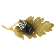 Brooch with garnet and rose diamonds 14k yellow gold and silver
