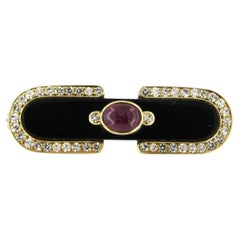 Brosche mit Onyx, Rubin und Diamanten im Einfachschliff bis zu 0,90 Karat, 18 Karat Gold