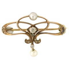 Brooch with pearl and diamonds 14k yellow gold