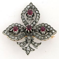Brooch with ruby and rose cut diamonds up to 0.50ct 18k gold and silver