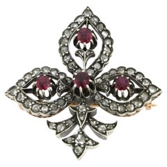 Brooch with ruby and rose cut diamonds up to 0.50ct 18k gold and silver