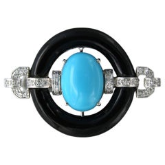 Brooch with turquoise, onyx and brilliant cut diamonds up to 0.24ct 14k gold