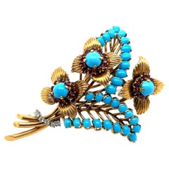 Vintage Brooch with Turquoise, Rubies & Diamonds in 18 Karat Yellow Gold by Gübelin
