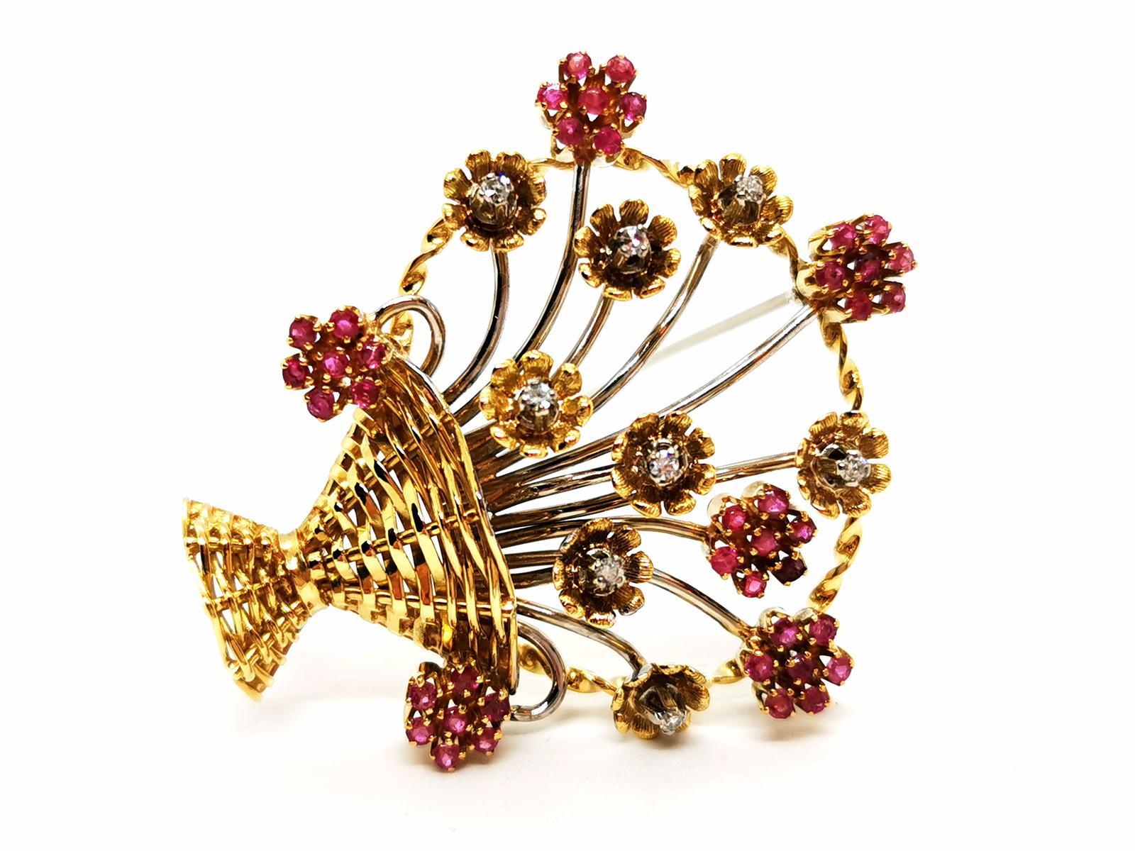 Ruby and diamond brooch. in yellow gold and white gold 750 milths (18 carats). featuring a basket of 14 flowers. set alternately. 8 brilliant diamonds. of about 0.015ct each. and 42 pink rubies. brilliant cut. of about 0.01ct each. total weight