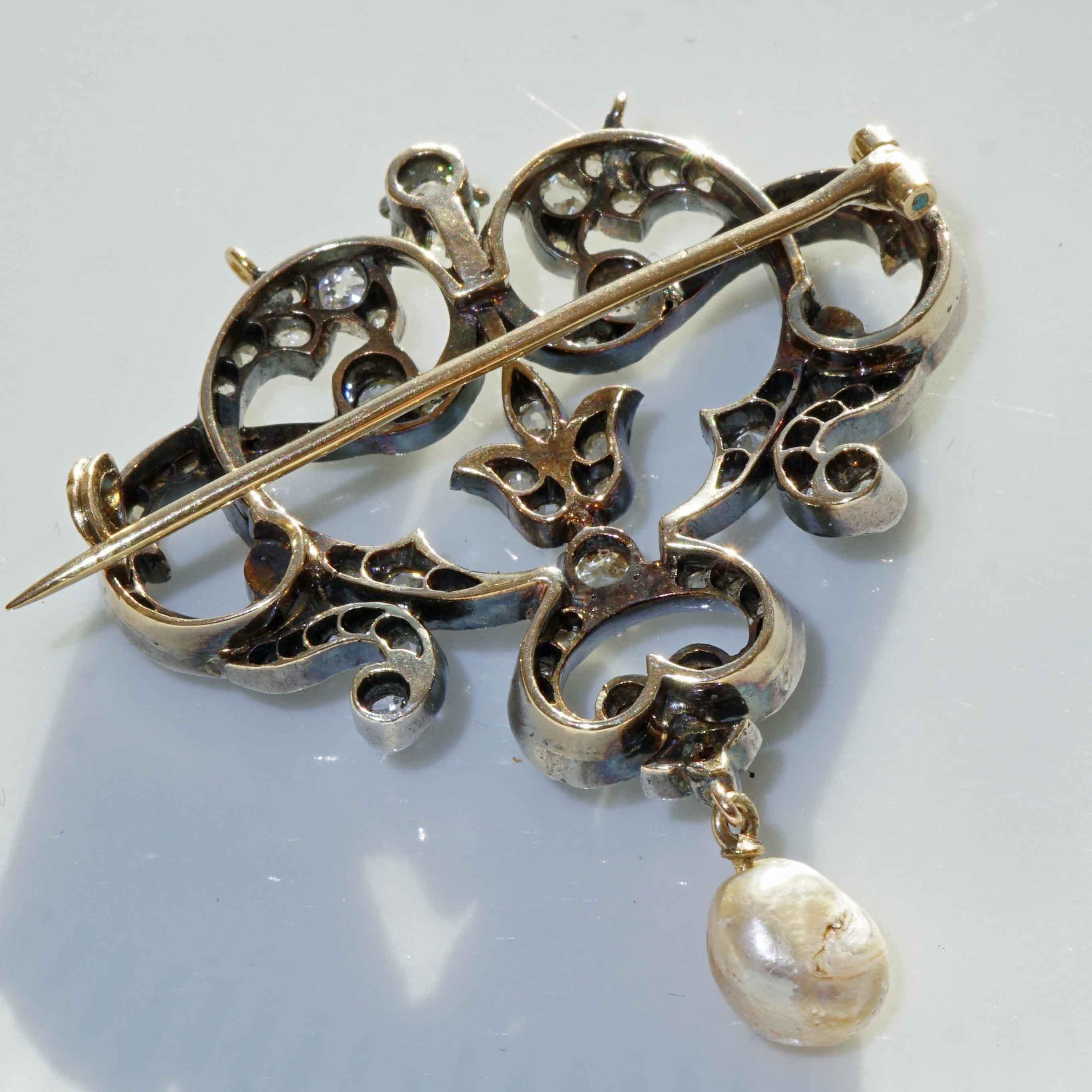 bows and garlands curved lines and foliage, beautiful brooch/pendant made at the end of the 19th century in a time that was characterized by the longing for lightness, dance and artistic creation, 700 yellow gold, 925 silver, 12 old European cut