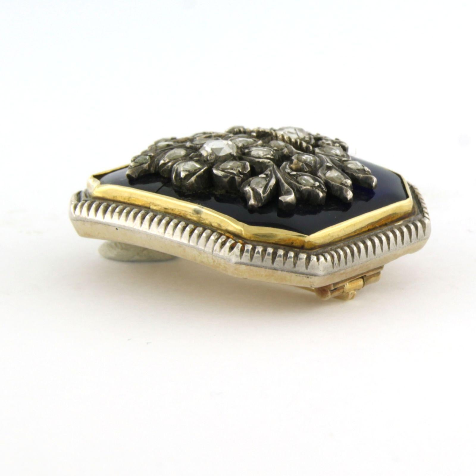 14k gold with silver brooch with blue enamel and set with rose cut diamonds total approx. 0.40 ct G/H - SI/P - 3.0 cm x 2.5 cm

detailed description

The brooch is 3.0 cm wide and 2.5 cm high, backside with bird and flower motif

weight: 14.0