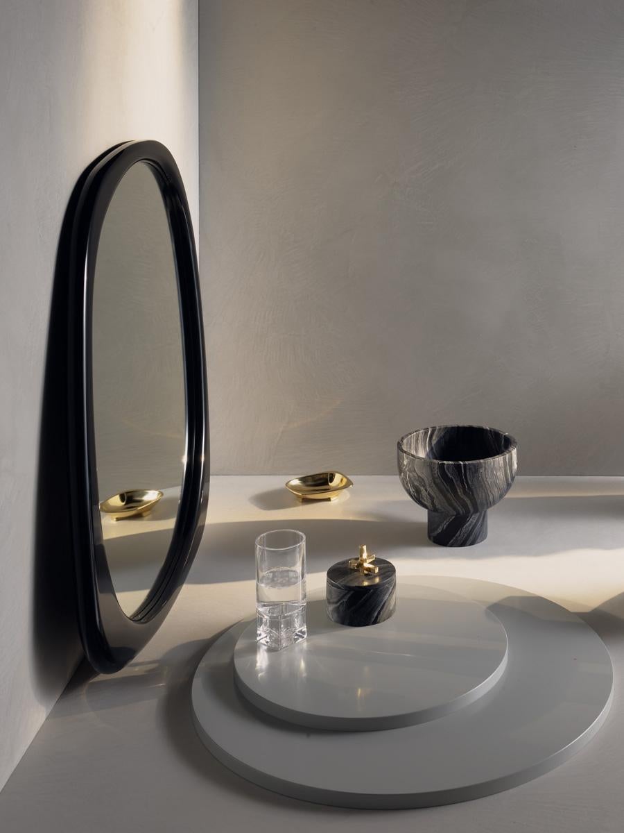 Inspired by the popular brass catchall, Brooke’s simple, subtle asymmetry makes it a gorgeous mirror.

Perfect on its own and as a feature, the smooth flowing elegant curves are the perfect accompaniment to any room.

Material:
Black high gloss