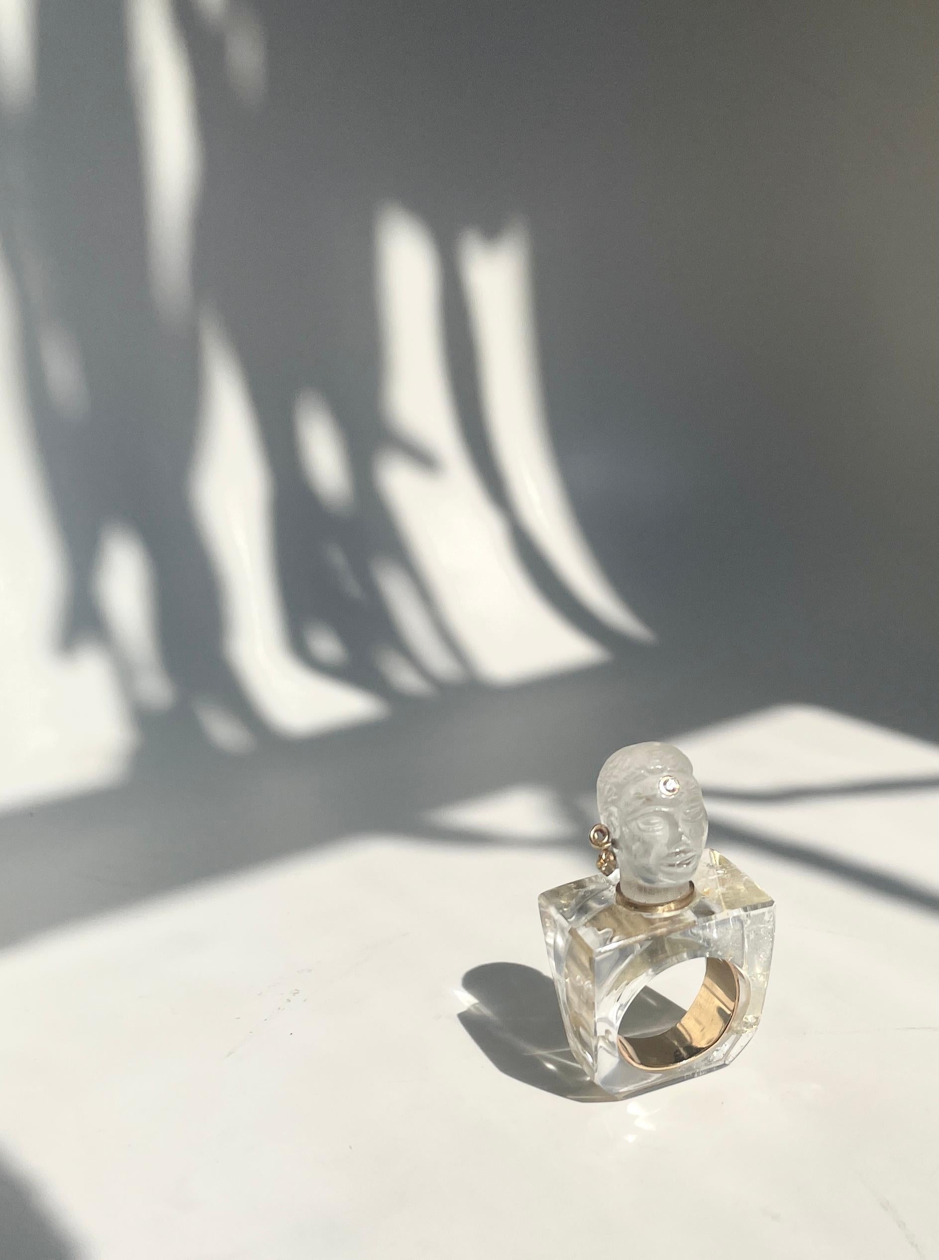 Brooklyamoor Olmec Statue Quartz Crystal, 14K Gold VVS Diamond Ring by L'ENCHANTEUR.

The Brooklyamoor Olmec head, is an artifact awaiting discovery. Mystic in every detail, each hand carved quartz head and ring is one of a kind. Life like facial