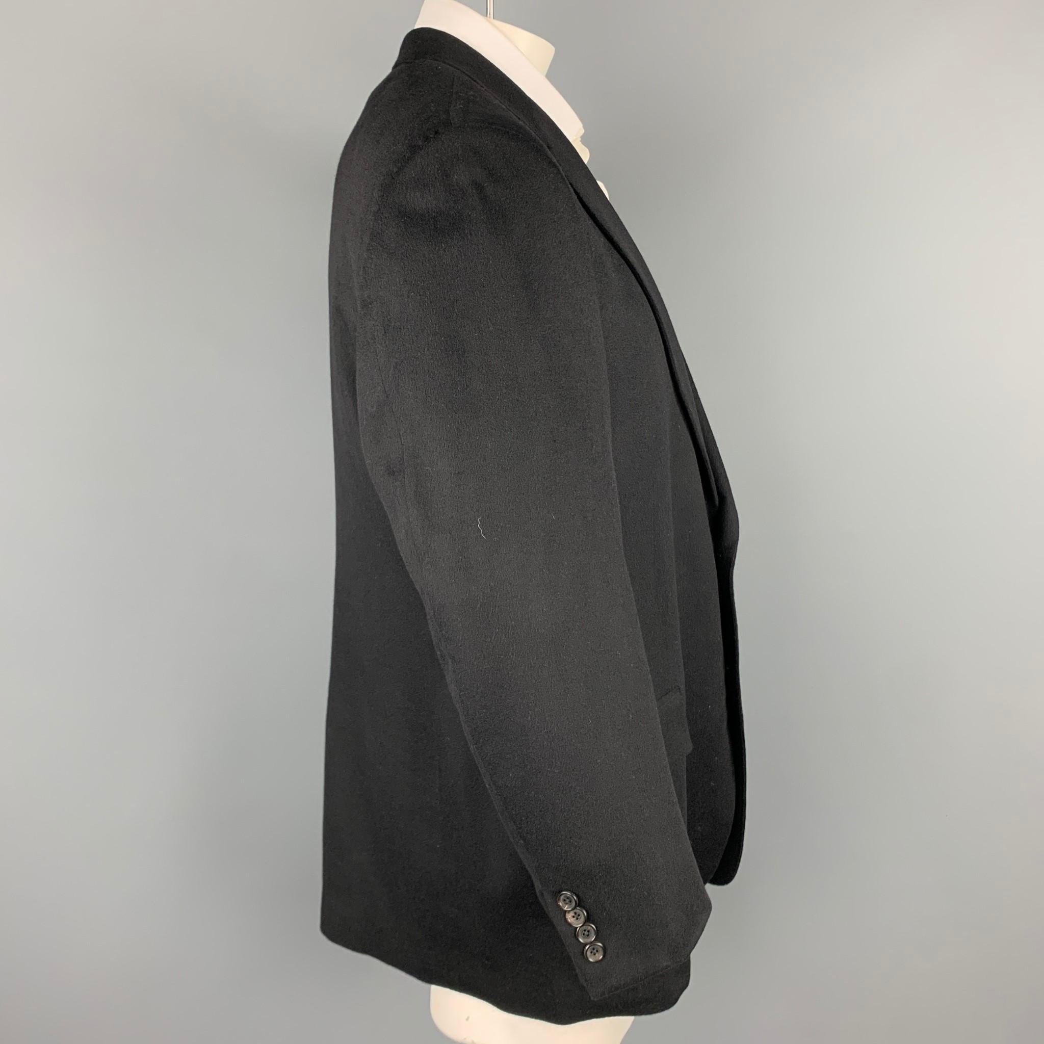BROOKS BROTHERS by LORO PIANA sport coat comes in a black cashmere with a full liner featuring a notch lapel, flap pockets, and a two button closure.

Very Good Pre-Owned Condition.
Marked: 46 R

Measurements:

Shoulder: 20 in.
Chest: 46 in.
Sleeve: