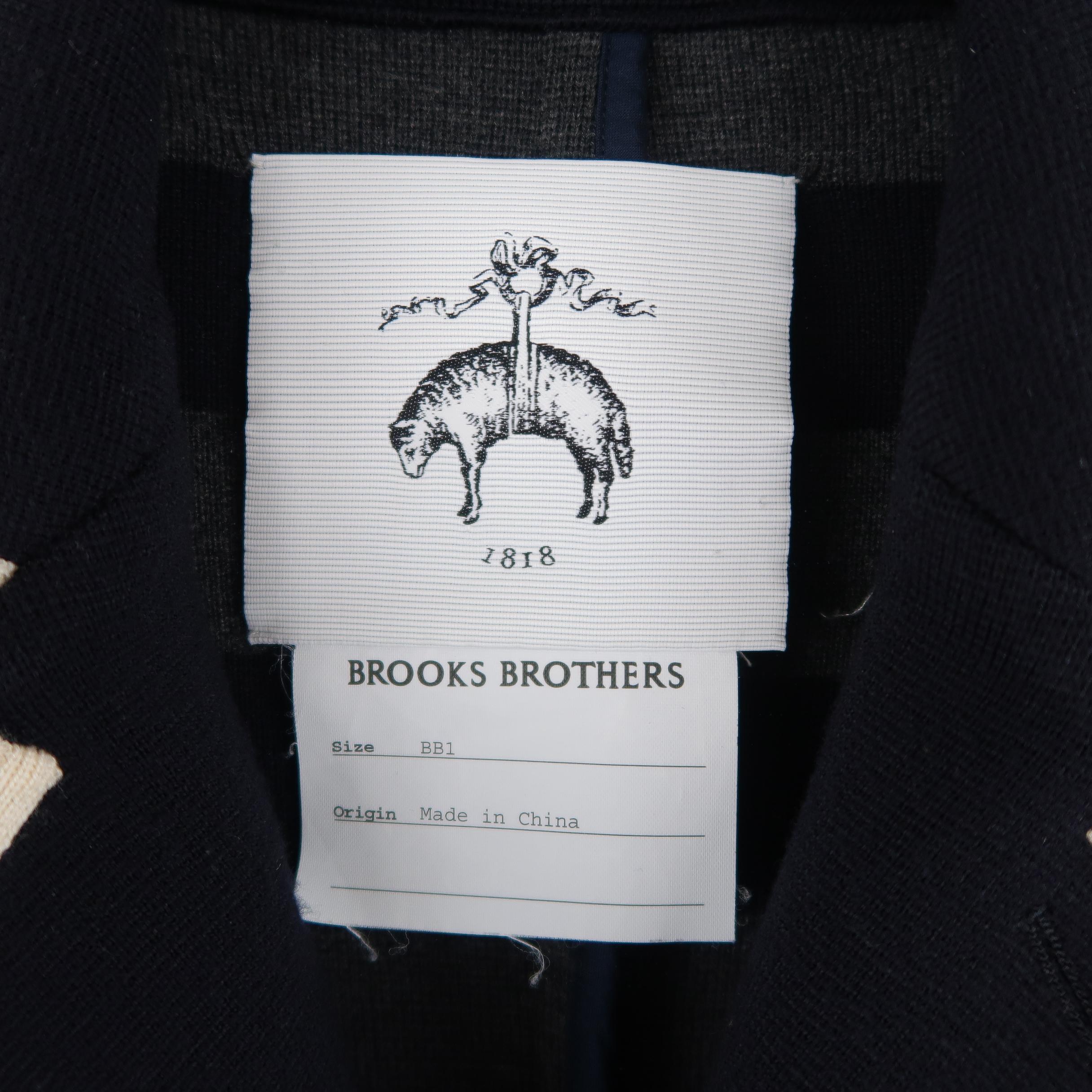 BROOKS BROTHERS sport coat comes in navy blue wool knit with cream and gray piping, notch lapel, three button single breasted front, flap pockets, and button cuffs. Retail price $1,800.00. 
 
Excellent Pre-Owned Condition.
Marked: BB1
