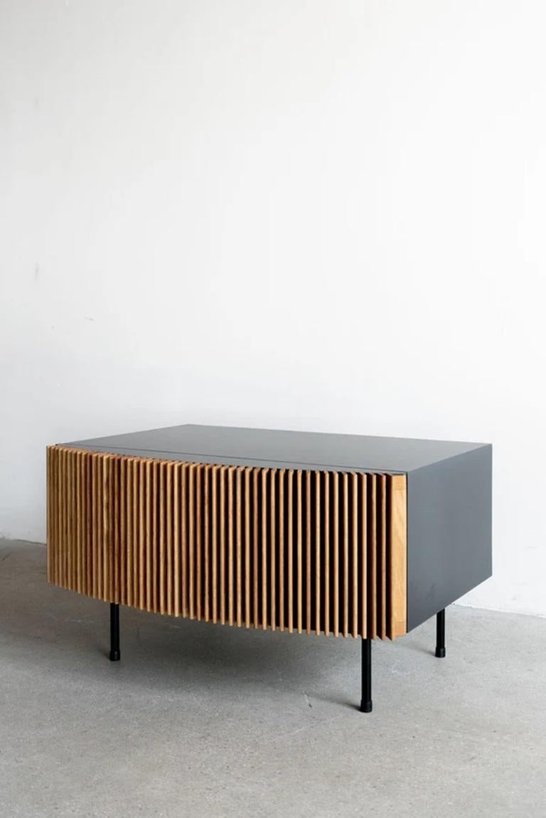 The Brooks Nightstand is handmade locally in Los Angeles, California. The refined design of the piece draws its original aesthetic through the combination of classic metal casing and carefully assembled oak facing. The industrial steel casing, a