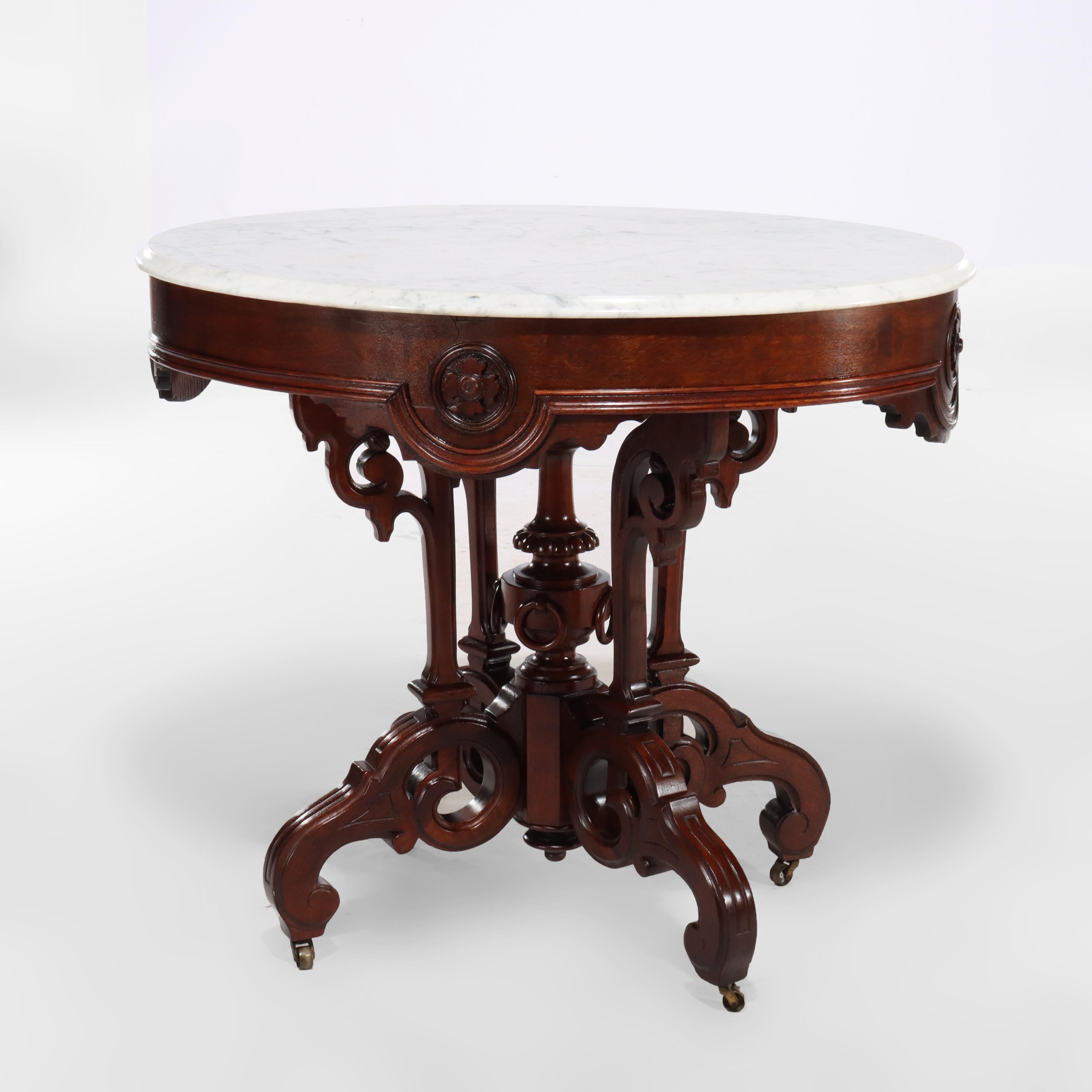 ***Reduced In-House Delivery Rates - Click on “Ask Seller” to Request a Quote***
Brooks Renaissance Revival Carved Walnut, Rosewood and Marble Parlor Table c1890.     
Measures - 34 1/2