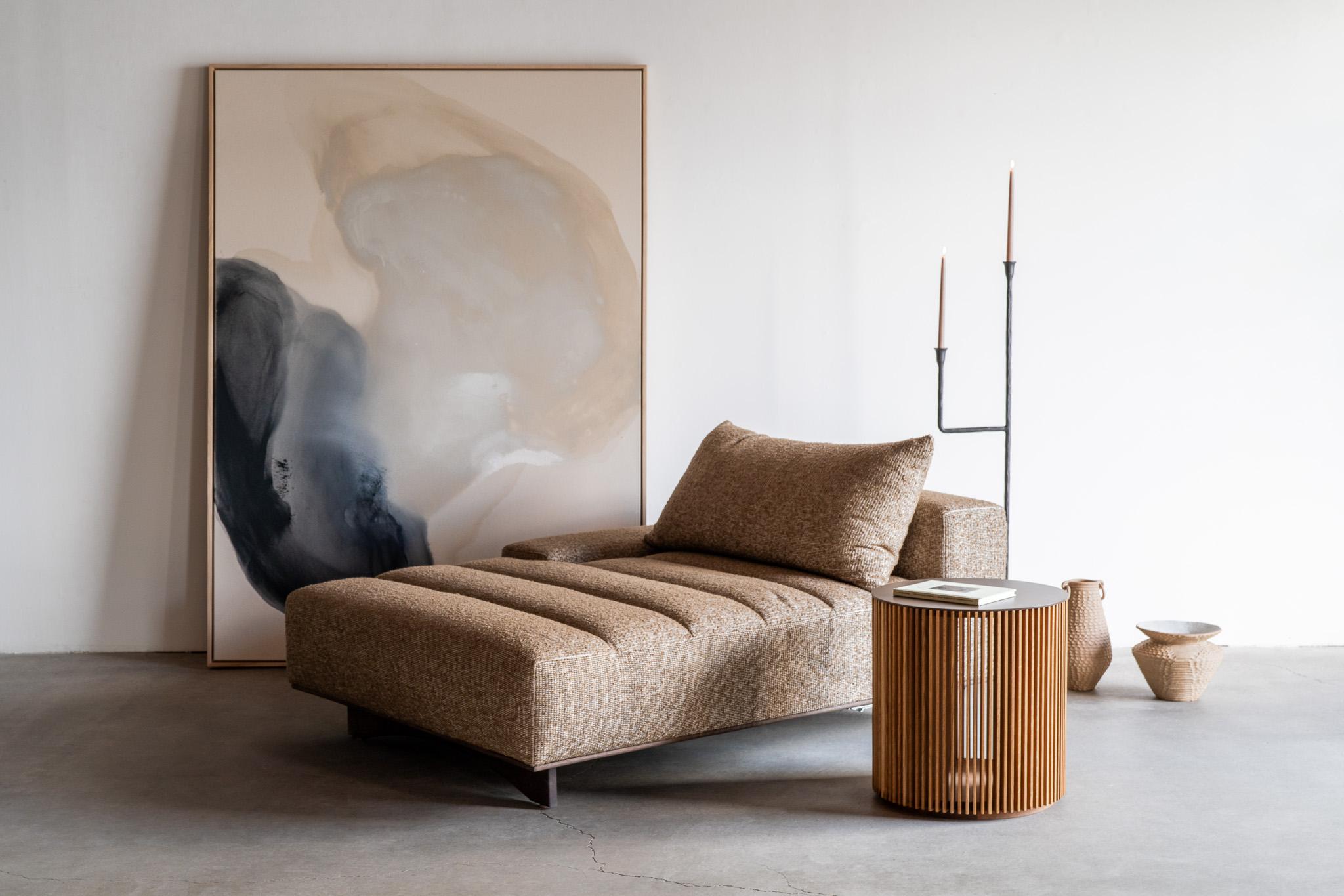 The Brooks Side Table seamlessly combines refined craftsmanship with architectural elegance. Featuring a cylindrical silhouette wrapped in precisely spaced vertical oak slats, this piece offers a stunning interplay of light and shadow that brings
