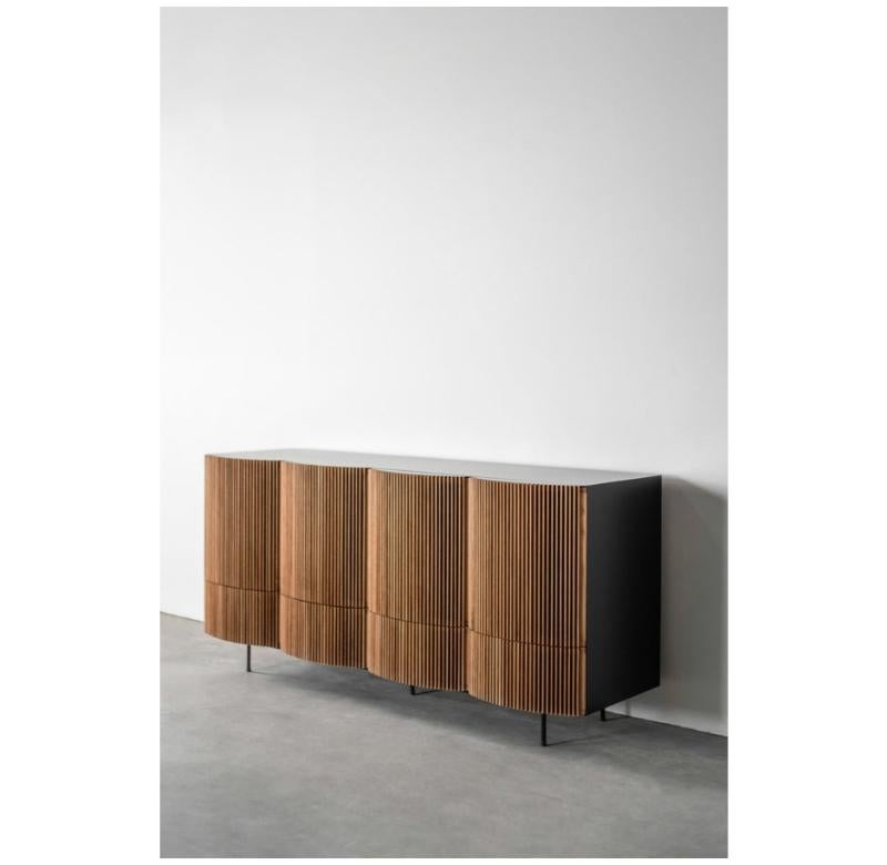 The Brooks Credenza is handmade locally in Los Angeles, California. The refined design of the piece draws its original aesthetic through the combination of classic metal casing and carefully assembled oak facing. The industrial steel casing, a