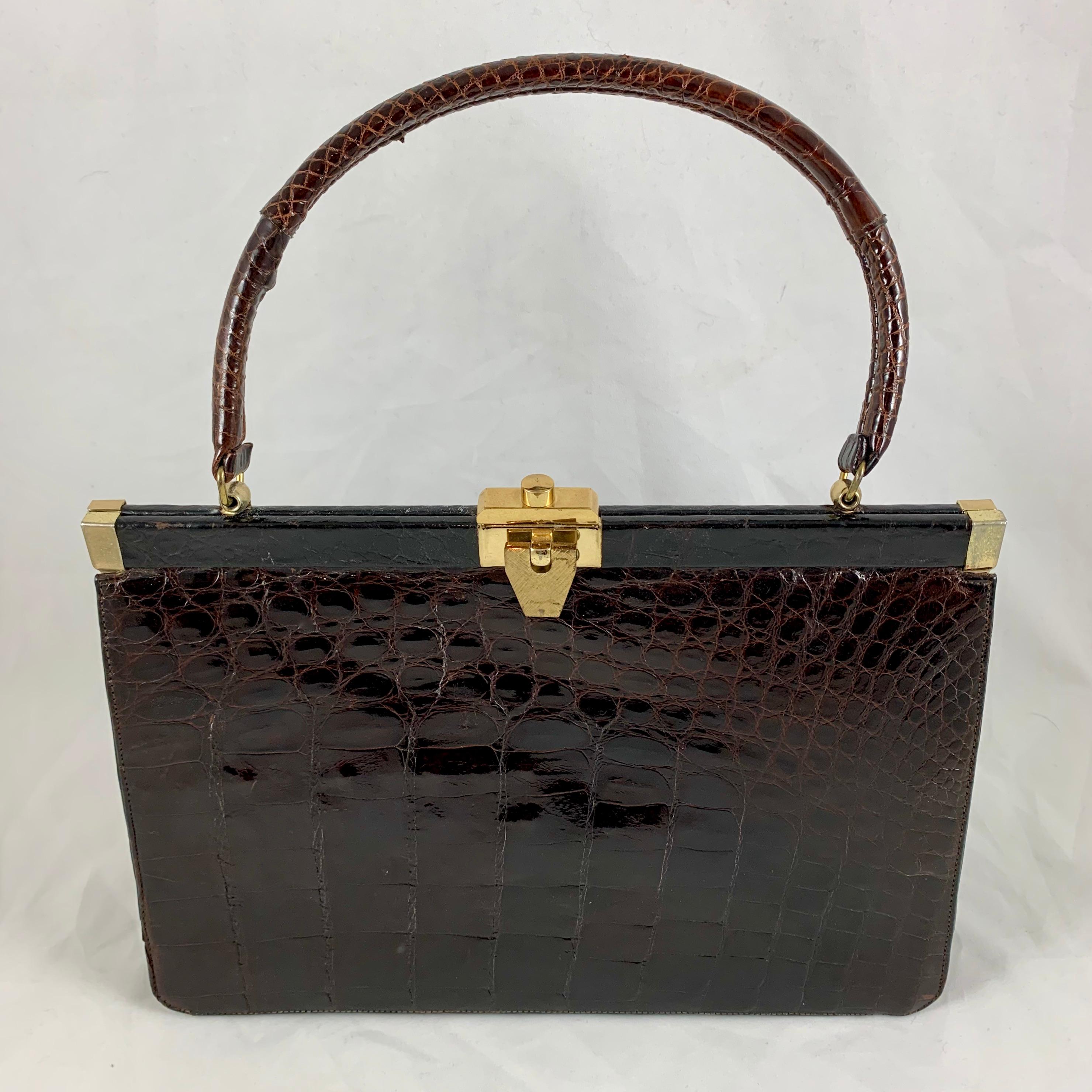From the mid to late 1950s-early 1960s, a structured, rich brown alligator handbag made by Bellestone Bags, Inc. in New York City. Bellestone bags were sold by Saks Fifth Avenue and Bonwit Teller from the 1940s-1960s. Bellestone was known for their