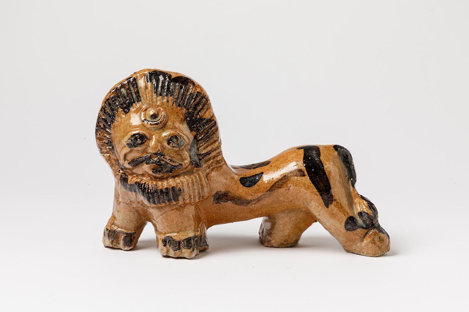 In the style of Guidette Carbonell.

Original lion ceramic sculpture. 

Brown and black ceramic glazes decorations.

Original perfect condition.

Unique handmade piece

Measures: height 17 cm, long 23 cm.