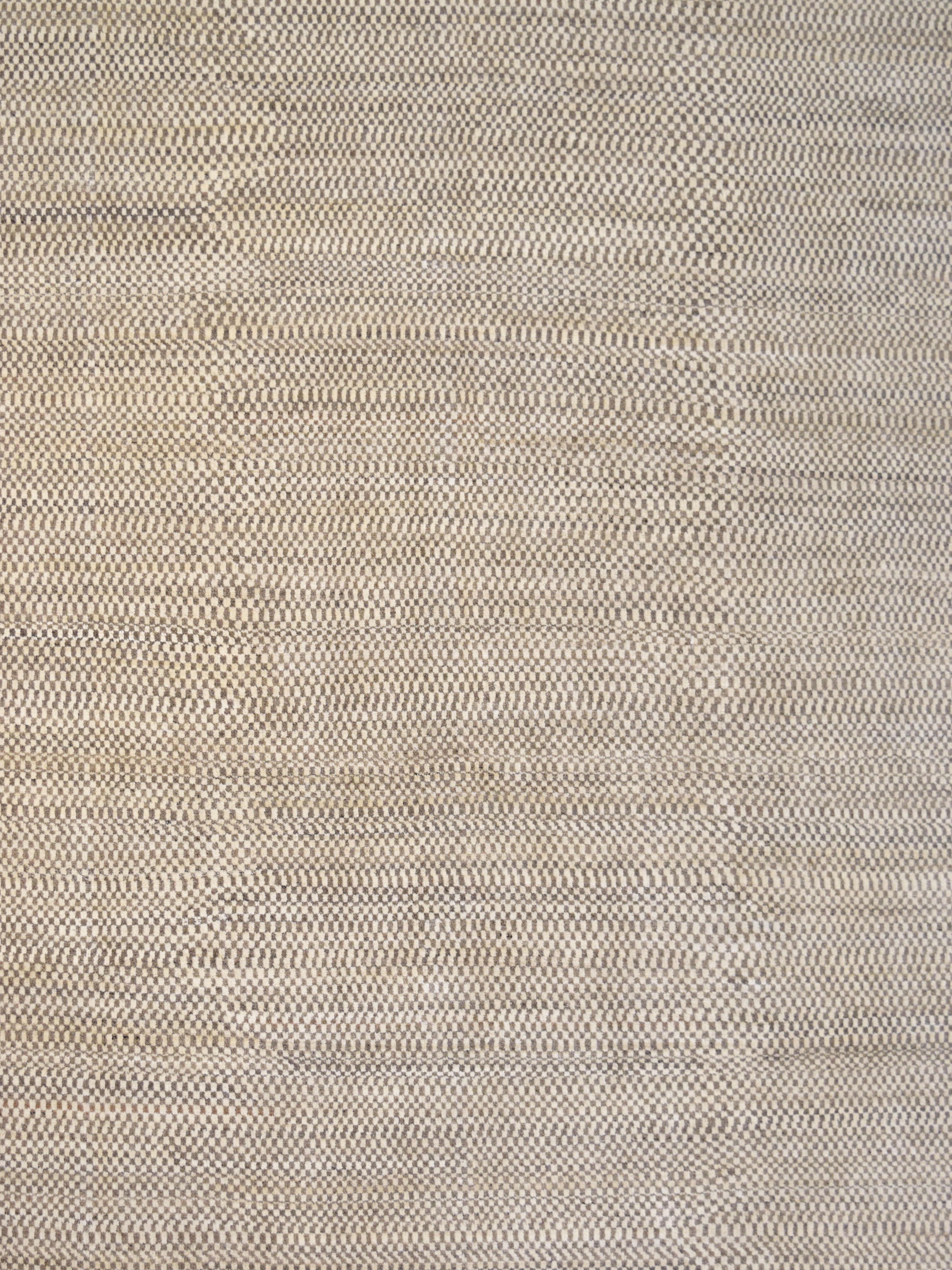 In simple tones of brown and cream, this approximately 8' x 10' modern and geometric Persian area rug, 