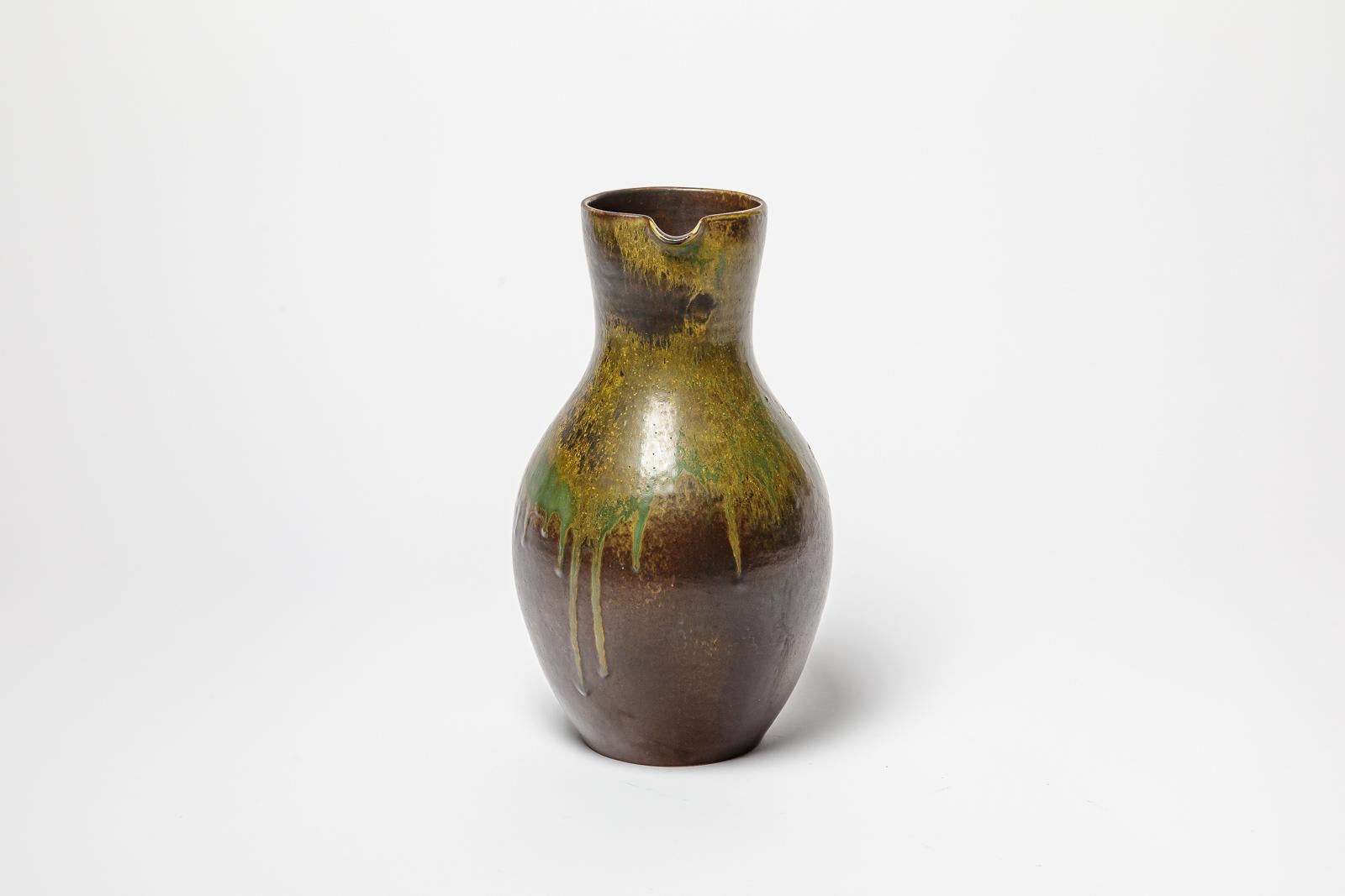 Beaux Arts Brown and green glazed ceramic pitcher by Roger Jacques, circa 1960-1970. For Sale