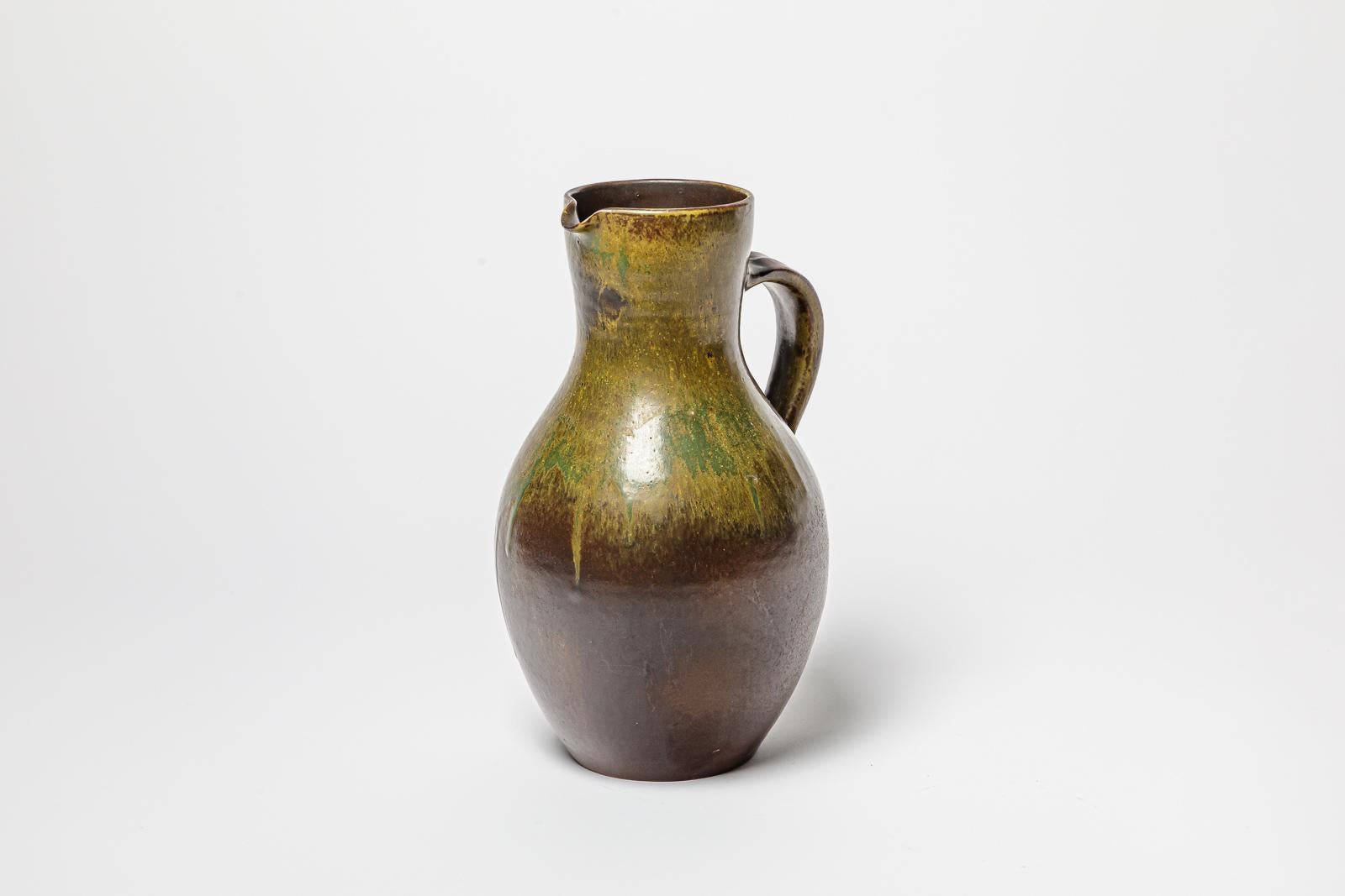 French Brown and green glazed ceramic pitcher by Roger Jacques, circa 1960-1970. For Sale